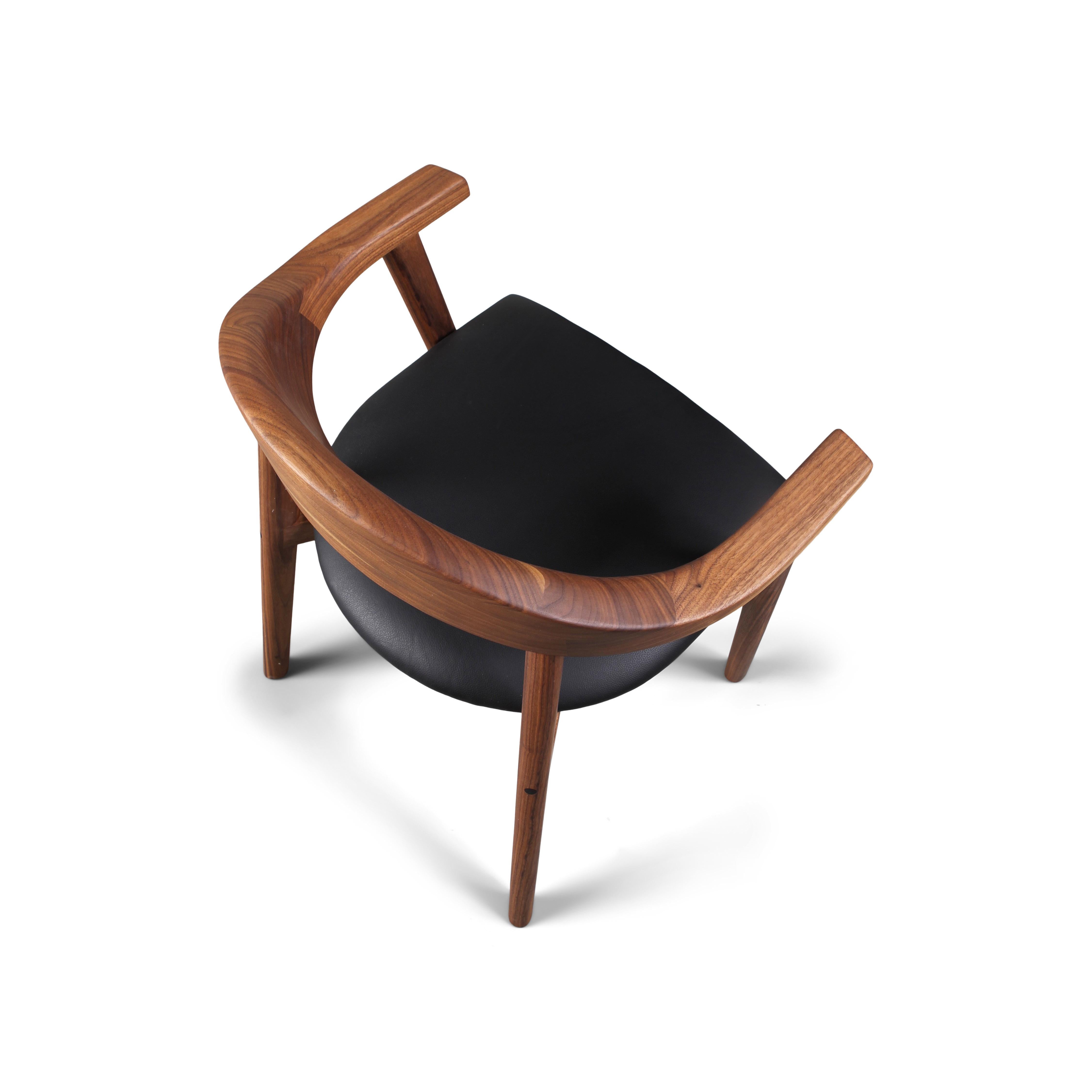 The solid wood Karve chair features soft curves and a contoured backrest exuding comfort and craftsmanship. Premium grade black walnut is hand-selected for character and color uniformity, beautiful from every angle.

The Karve upholstered chair is