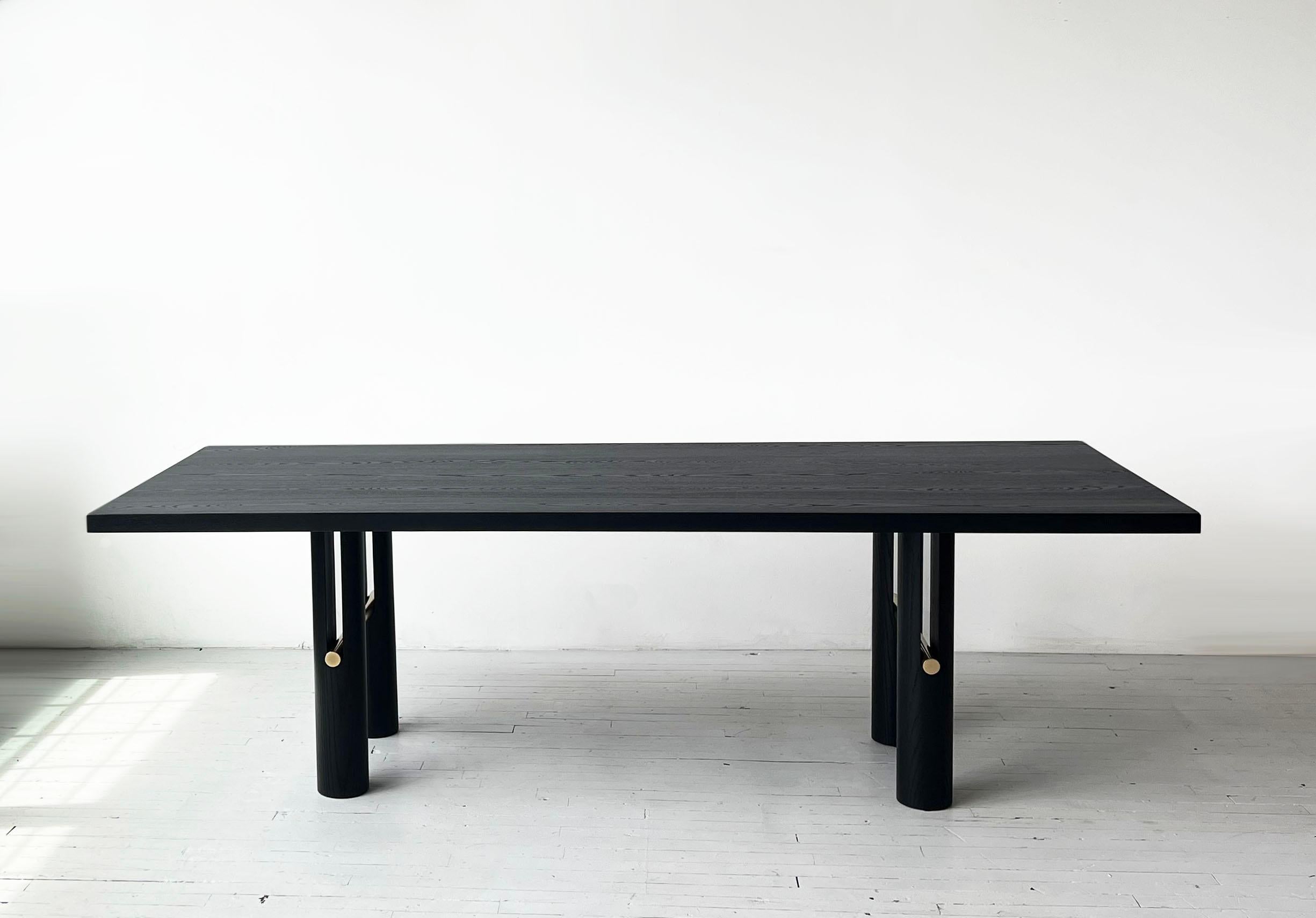 The Loup table is a timeless piece that
explores movement and mass. Its legs
are cradles for the solid metal rods that
seemingly push their way through the
forms. A delicate connection to the table
top is balanced by the solid legs meeting
the floor.