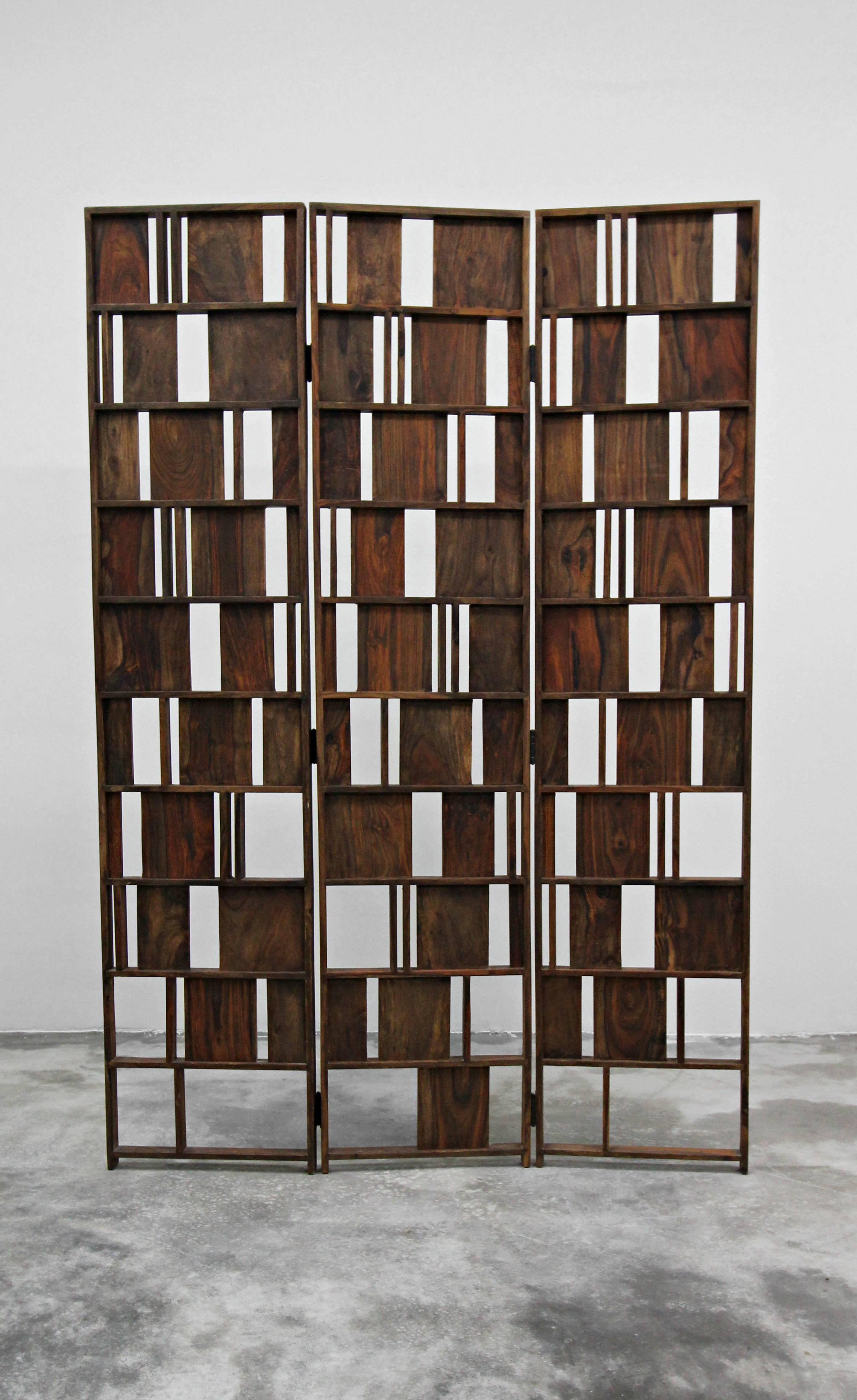 Solid wood three-panel folding room divider screen. Wood has beautiful color and grain. Beautiful art piece. Very heavy.