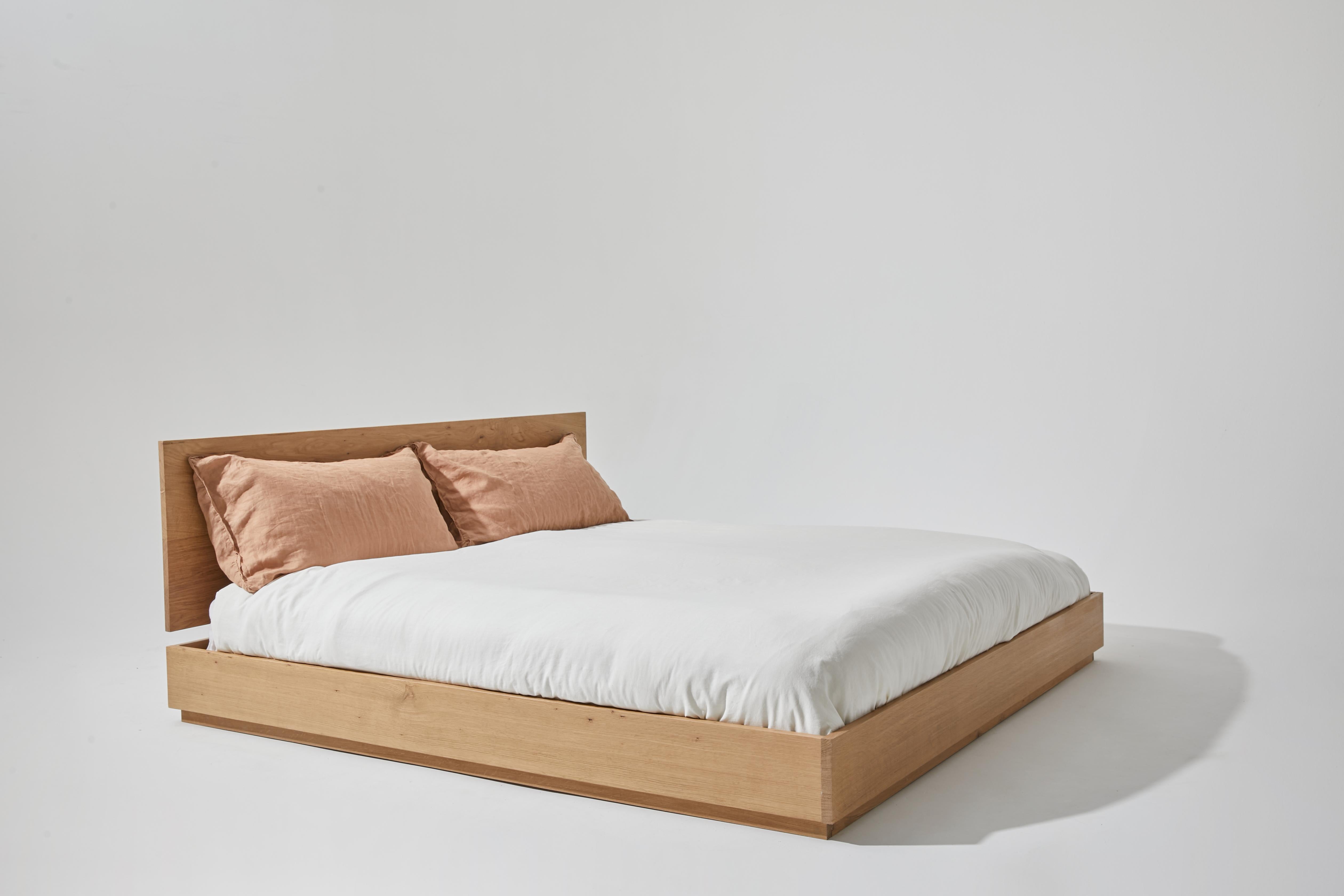 The heath bed frame brings a grounded feel to any bedroom. It has a sense of connectedness. Built from solid wood, this piece foregoes traditional framing and legs and leans into a Japanese inspired style. Every headboard is hand-selected for its