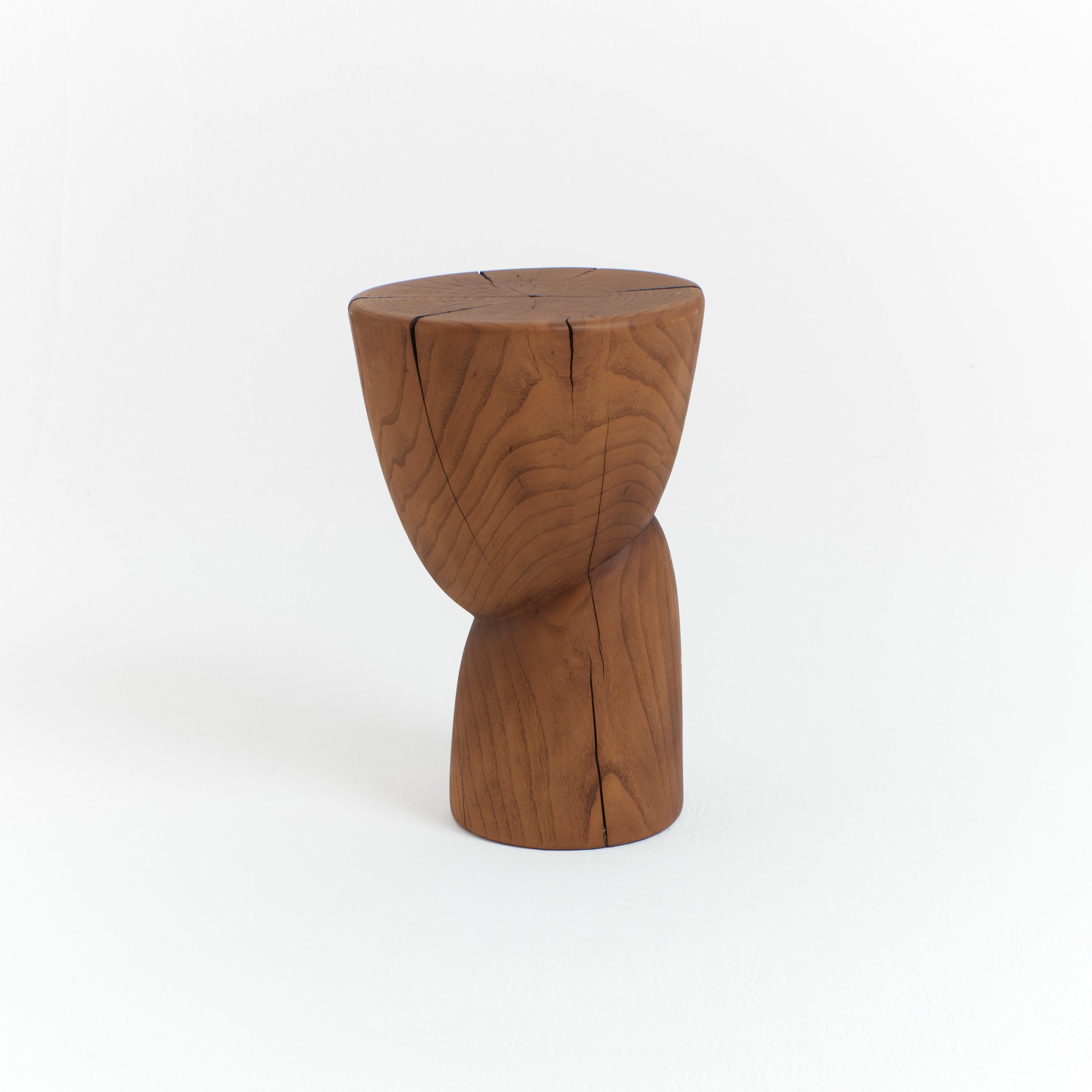 Wooden side table in solid wood with an oiled finish.
Designed by Project 213A in 2020 
This sculptural side table is hand carved by local artisans in Portugal using solid chestnut which shows the natural grain and characteristics of the
