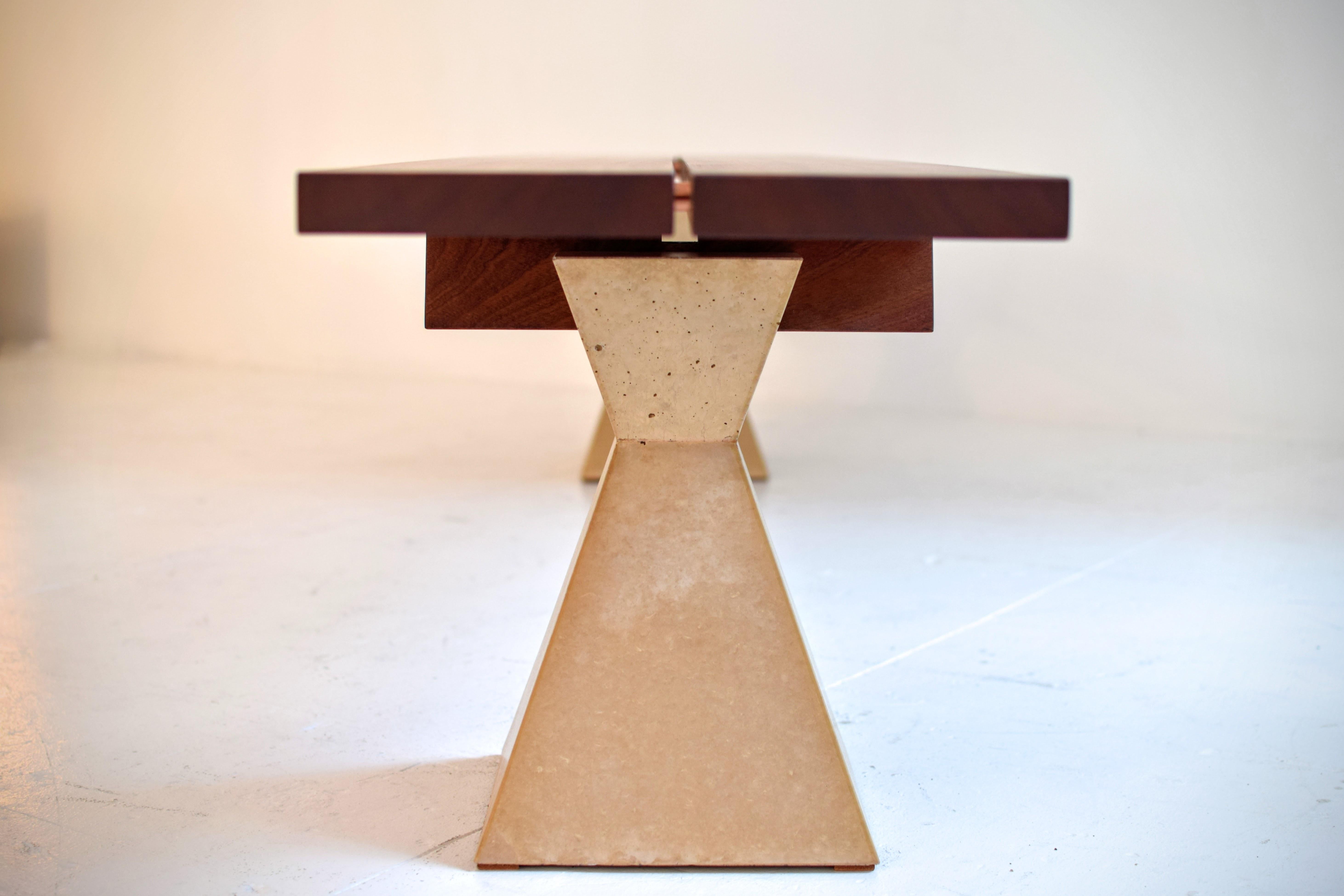 Dovetail stool

This distinctive stool combines multiple curves in wood, a geometric tower of concrete and the clever use of dovetail joinery. The split, wooden seat—power carved and polished in a perfect radial bowl—is linked with bronze pins and