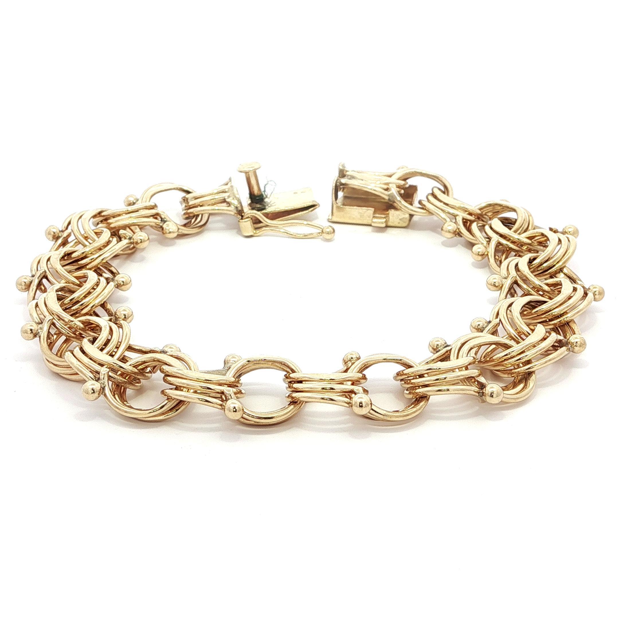 Material: Oro amarillo macizo de 14 quilates 
Peso: 27,18 gramos
Tipo de cadena: Eslabón de bordillo doble ancho
Longitud de la cadena: Mide 7,5