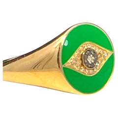 Ring aus massivem Gelbgold mit grüner Emaille und schwarzen und weißen Diamanten und Evil Eye