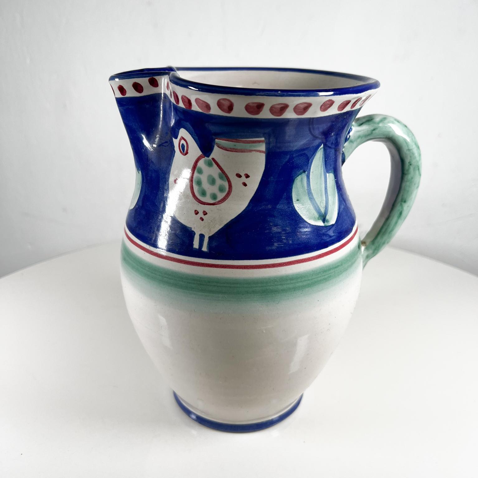 Solimene Hand Painted Vietri Italian ceramic blue green pitcher chicks design Italy
CERAMICHE SOLIMENE 
Vintage Italian blue pitcher signed at bottom, Solimene Italy
7.25 d x 5.75 w x 8.5 tall
Original vintage condition
See all images.


