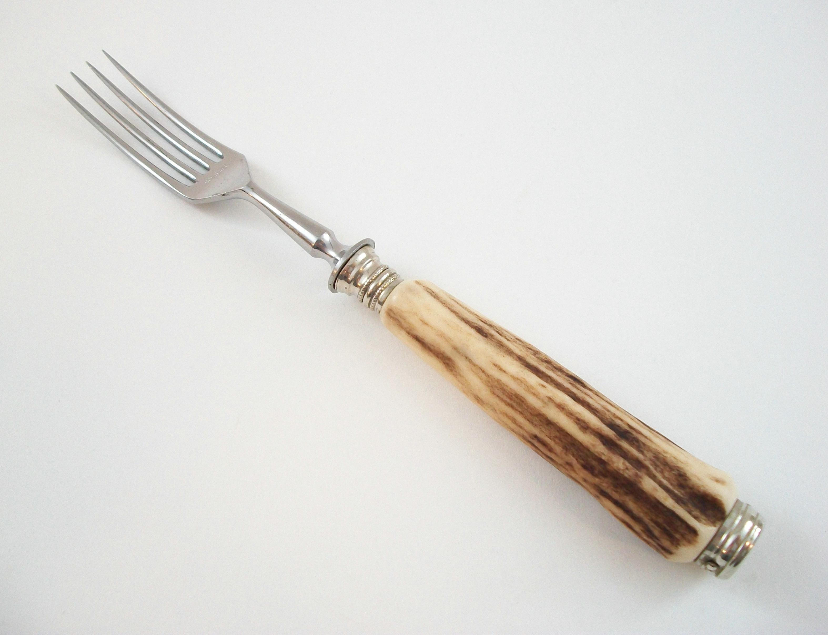 HUBERTUS SOLINGEN - Vintage stainless steel fork - featuring an antler handle - unsigned - Germany - circa 1950's.

Excellent vintage condition - surface scratches - enamel loss - no restoration - signs of age and use.

Size / Dimensions - 7 1/2