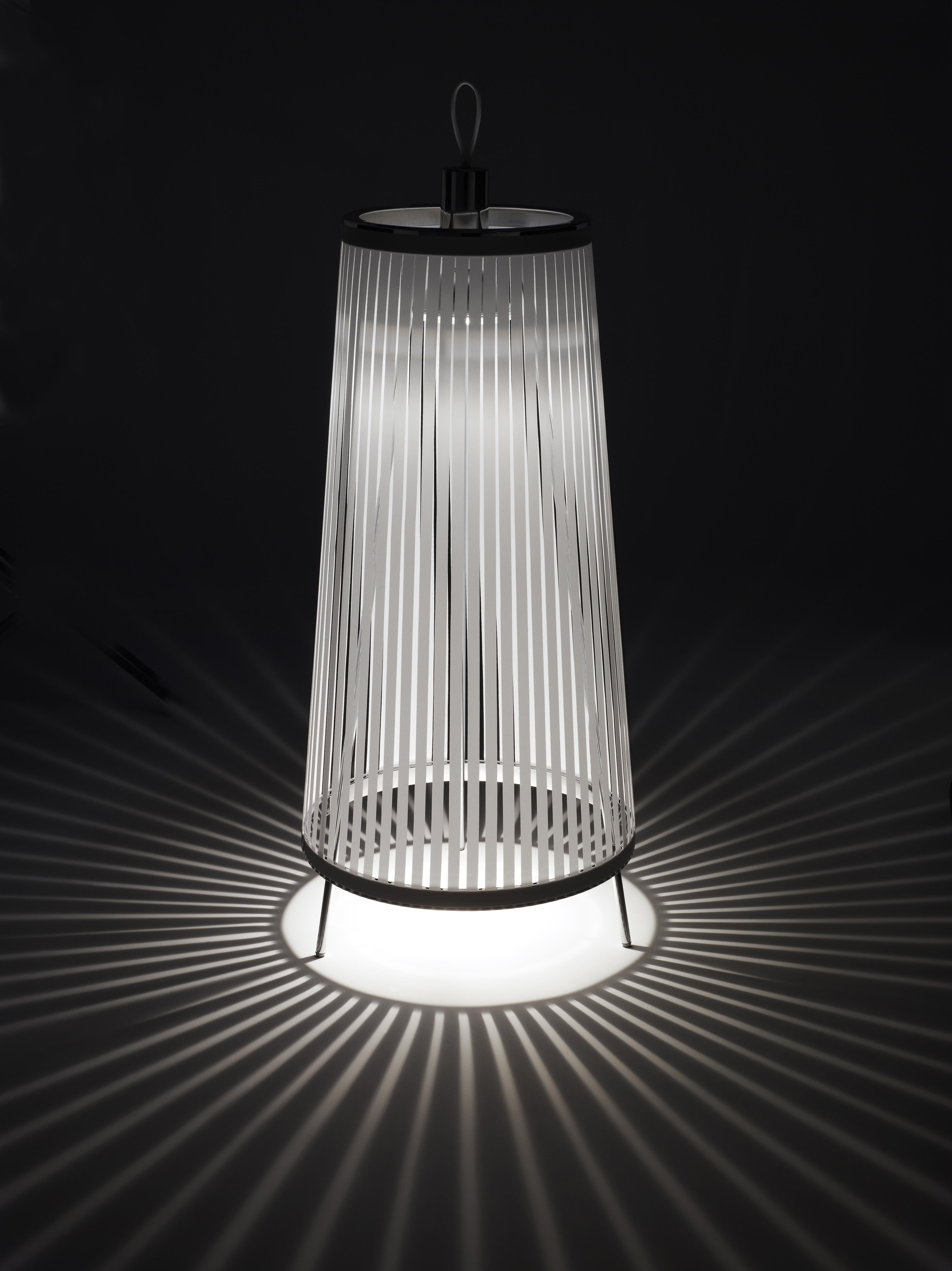 Solis is an innovatively simple and elegant suspension lamp that can be used as a pendant, hung from a wall, or as a freestanding portable luminaire to create a distinctive ambiance. The resulting piece is an engaging blend of light and shadow,