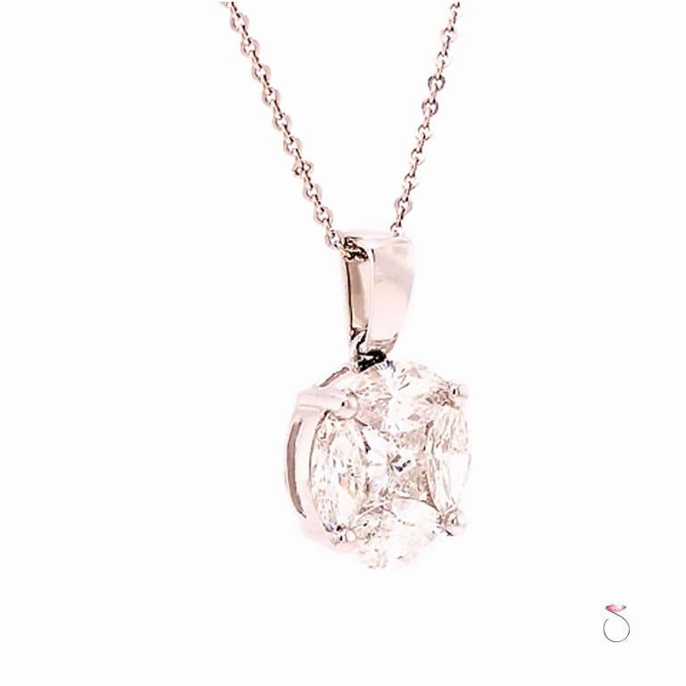 Designer Illusion set diamond pendant in 18k white gold on 14K white gold chain. This gorgeous diamond pendant features four marquise shape diamonds surrounding a princess cut diamond creating an illusion of a much bigger diamond look. The diamonds