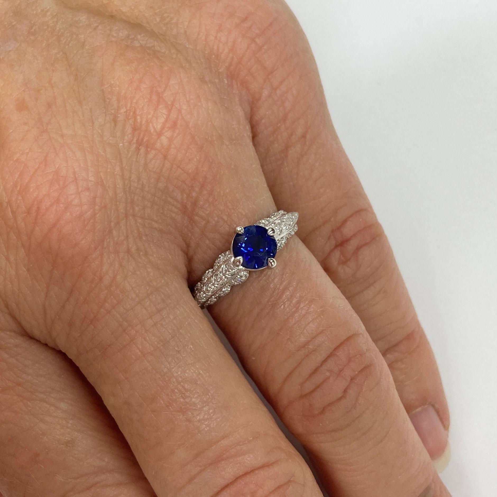 This extraordinary Ring in 18 Kt White Gold showcases a blue Sapphire of 1.23 ct in a 4 prong setting . The shoulders have an organic appearance and are pave set with 90 Diamonds with a total weight of 0.22 ct F/G if. 
This piece is the perfect