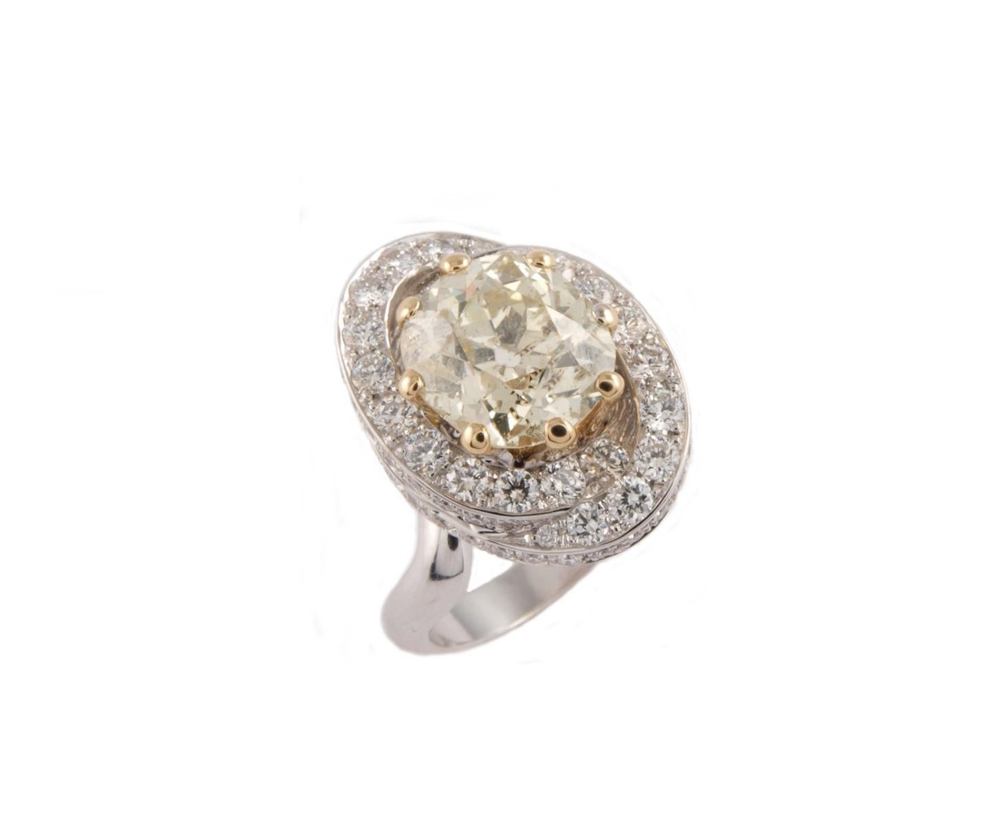 Solitaire ring with ct 3.75 cushion old mine yellow diamond 
It is set with a triple ellice with round brilliant cut Diamonds ct 1.48
The ring is 18 k white gold
Ring size 53.5 

the high quality of this jewel is the expression of the skilful work