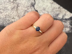 Solitaire Blue Sapphire with Baguette Diamond Accents Ring in 14k Yellow Gold