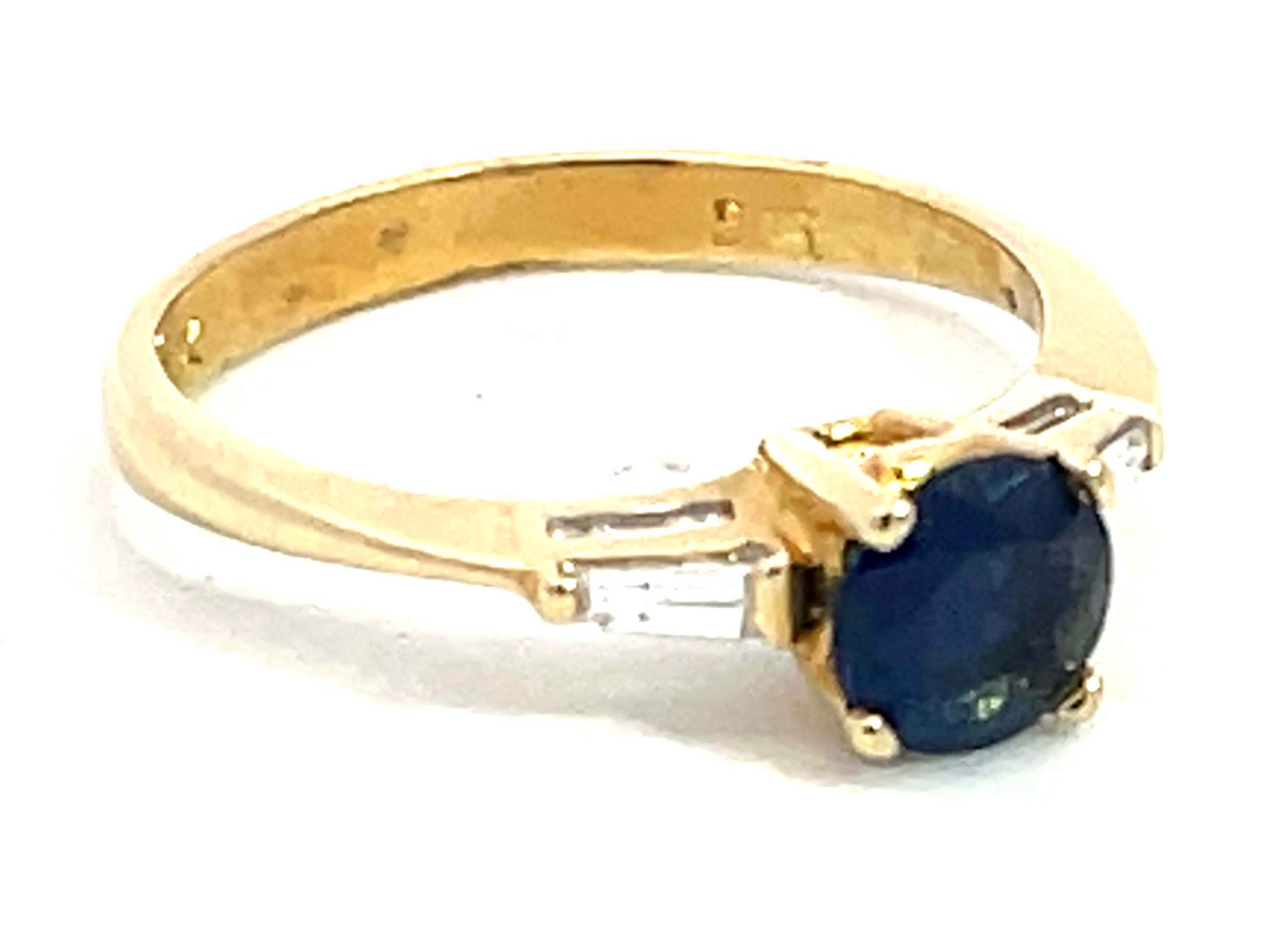 Modern Solitaire Blue Sapphire with Baguette Diamond Accents Ring in 14k Yellow Gold For Sale