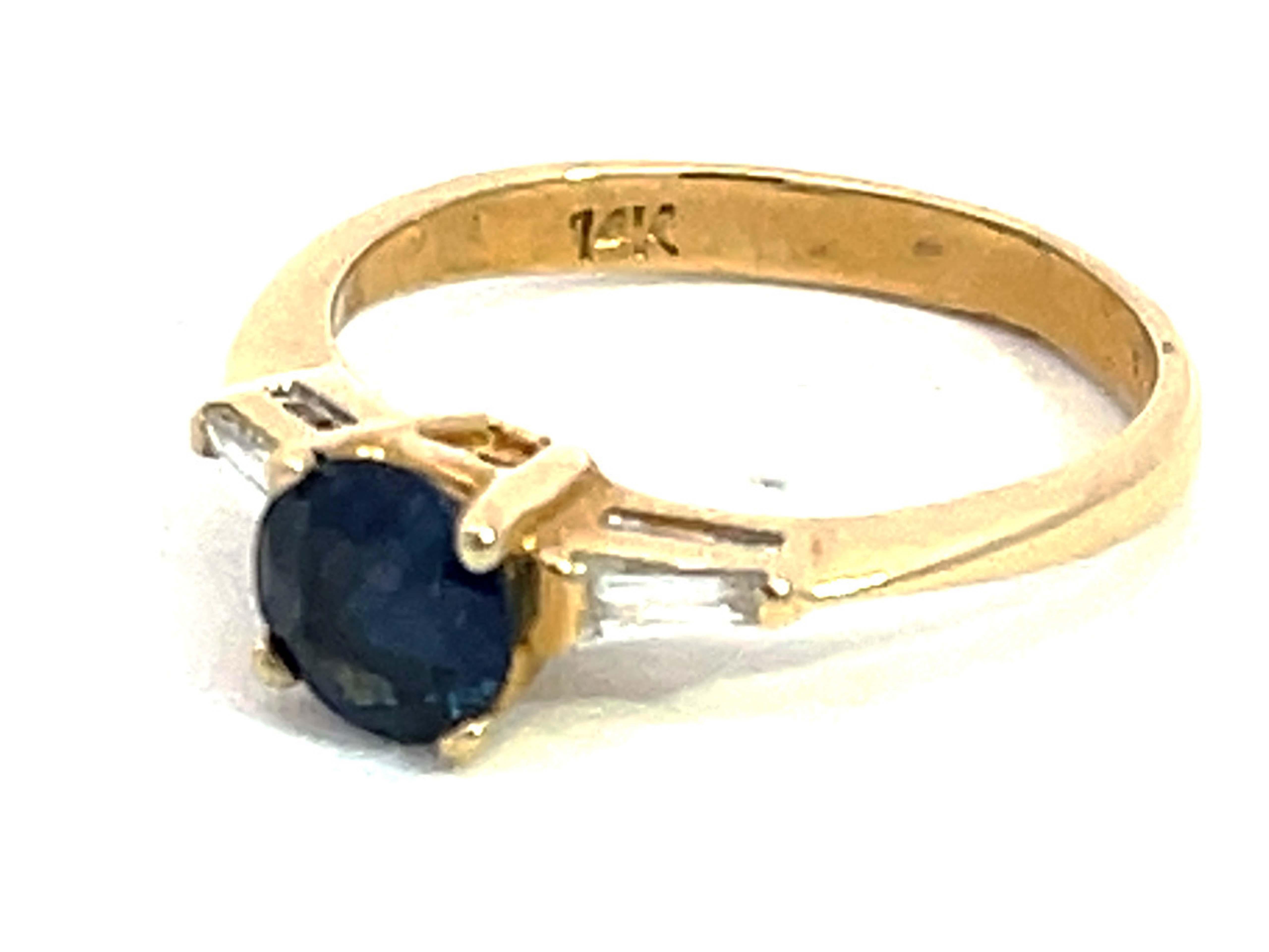 Round Cut Solitaire Blue Sapphire with Baguette Diamond Accents Ring in 14k Yellow Gold For Sale