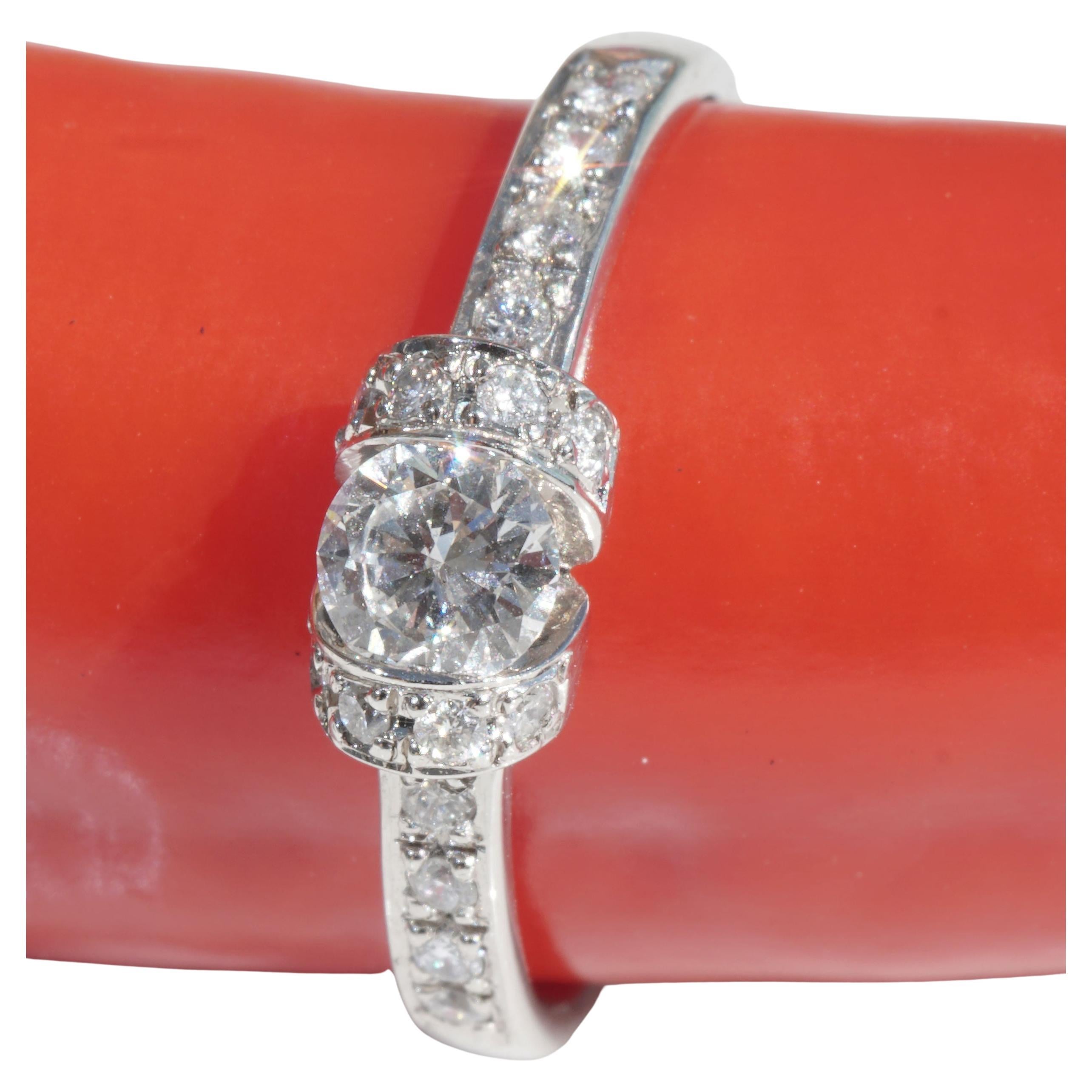 this great platinum ring is very noble worked, a full cut brilliant of about 0.337 ct / 4.6 mm diameter TW (fine white G) / SI (small inclusions) great brilliance and in the ring shoulders pavee set full cut diamonds total about 0.18 ct, TW (fine