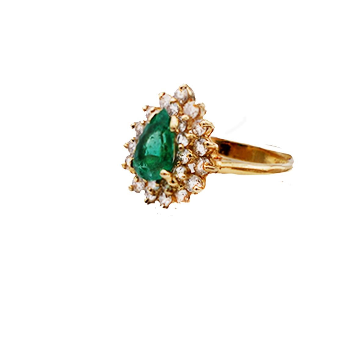 Stunning Cocktail, Pear Shaped Colombian Emerald Set in a Double Diamond Halo, 
Set in 14 Karat Yellow Gold

The pear set emerald is surrounded by a double halo of 27 prong set round brilliant diamonds. 
Rich colored, Colombian Emerald measures 9.03