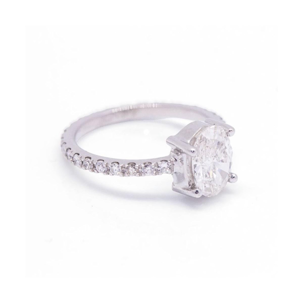 Ring in White Gold for woman  1x Oval Cut Diamonds, weight 1.01cts., quality H/Vs (With GIA Certificate). Accompanied by a pave of diamonds with a total weight of approx. 0.40ct.  Size 7  18kt White Gold  2.40 grams.  This ring is in excellent