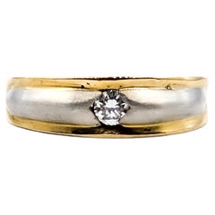 Anello con diamante solitario in platino e oro giallo 18 carati