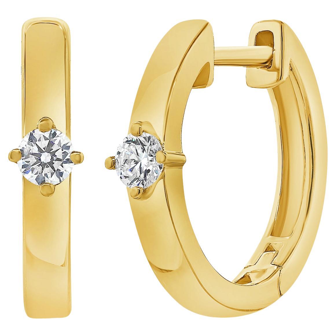 Pendientes de aro Huggie con diamante solitario 0,12 quilates Oro amarillo de 14 quilates en venta