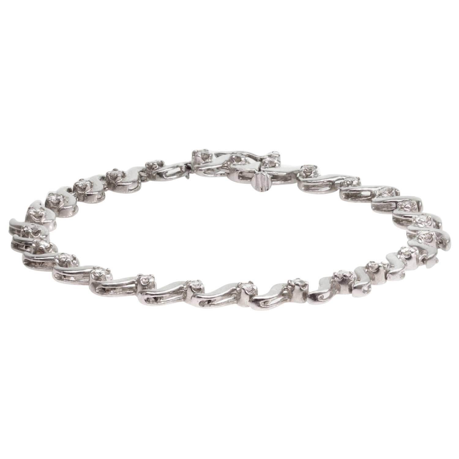 Bracelet de tennis solitaire à maillons en or blanc et diamants