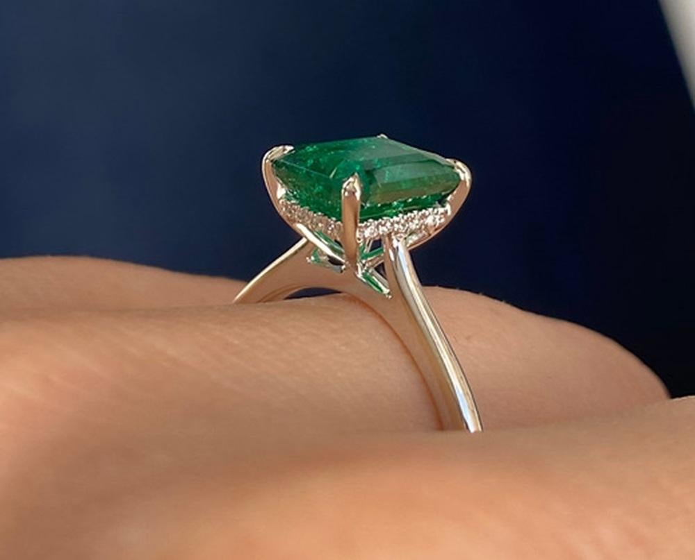 Emerald Weight: 1.84 CTS, Measurements: 8.99 x 7.15 mm, Diamond Weight: 0.04 CT, Metal: 18K White Gold, Ring Size: 6.5, Shape: Emerald-Cut, Color: Green, Hardness: 7.5-8, Birthstone: May