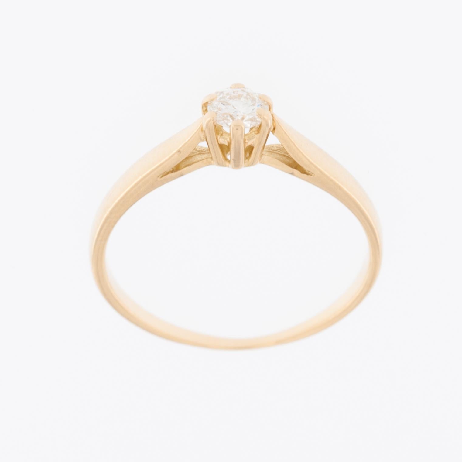 The Solitaire Engagement Ring in 18kt Yellow Gold with Diamond is a classic and timeless piece of jewelry designed for engagements. 

The ring is crafted from high-quality 18-karat yellow gold, known for its warm and lustrous appearance. This
