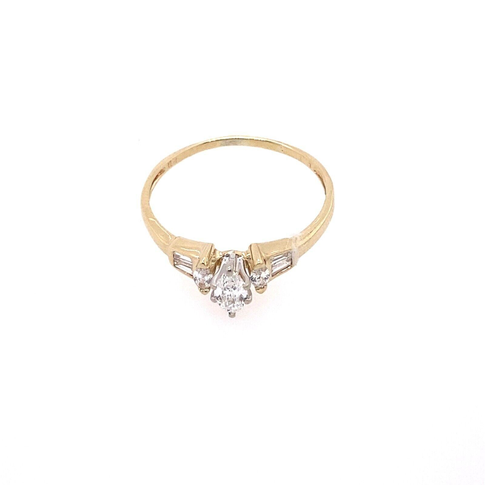 This beautiful ring features a natural 0.30ct marquise diamond with a VS1 clarity and G colour grade, set on a 14ct gold band. The 4 tapered diamonds on each side add a complementary sparkle and shine.

Additional Information: 
Total Diamond