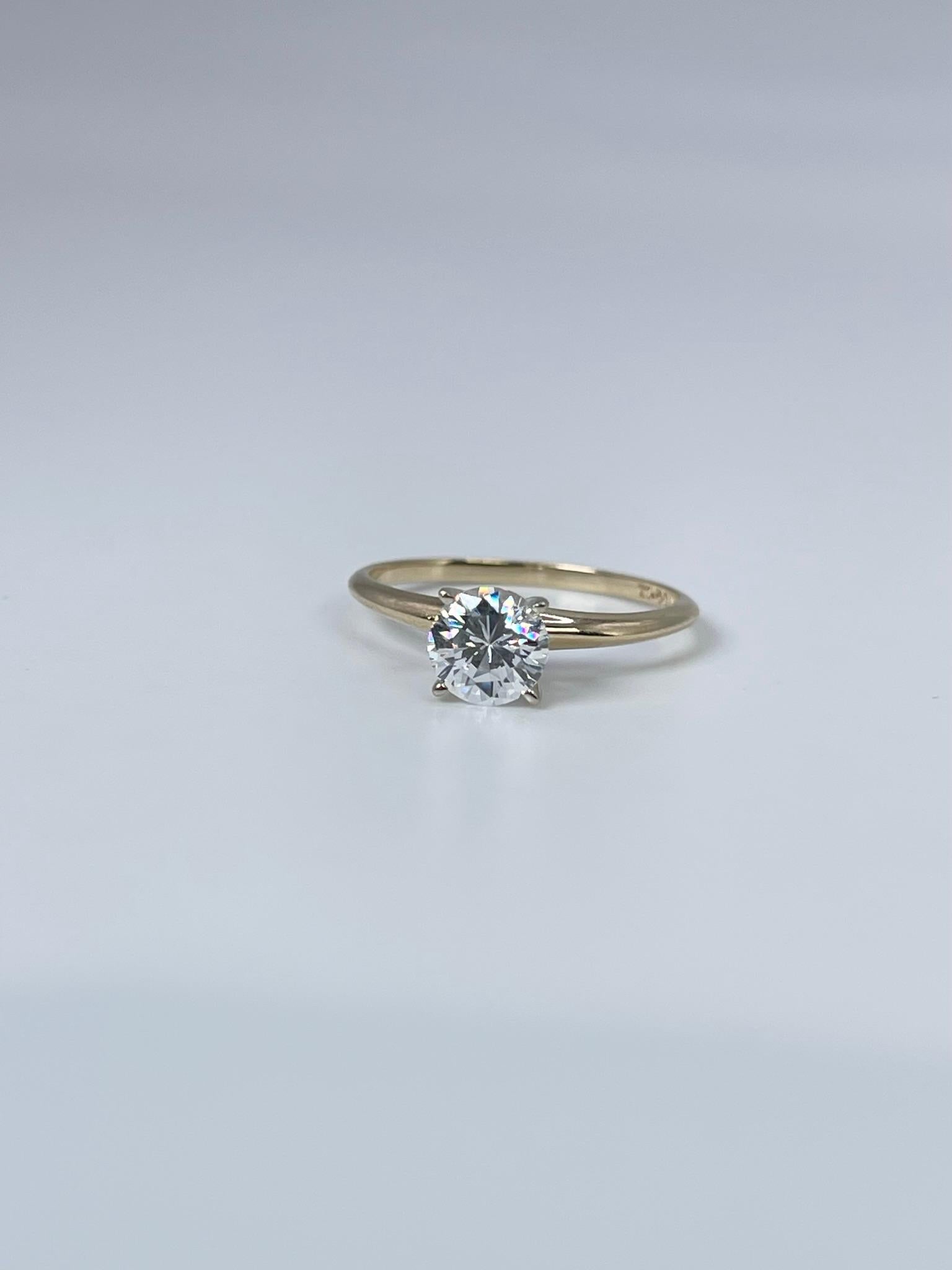 Certified moissanite solitaire ring in 14KT yellow gold, great for marriage, travel ring or promise ring. Comes with certificate of card for moissanite as well as certificate of authenticity for the ring.

GRAM WEIGHT: 2.08gr
GOLD: 14KT yellow