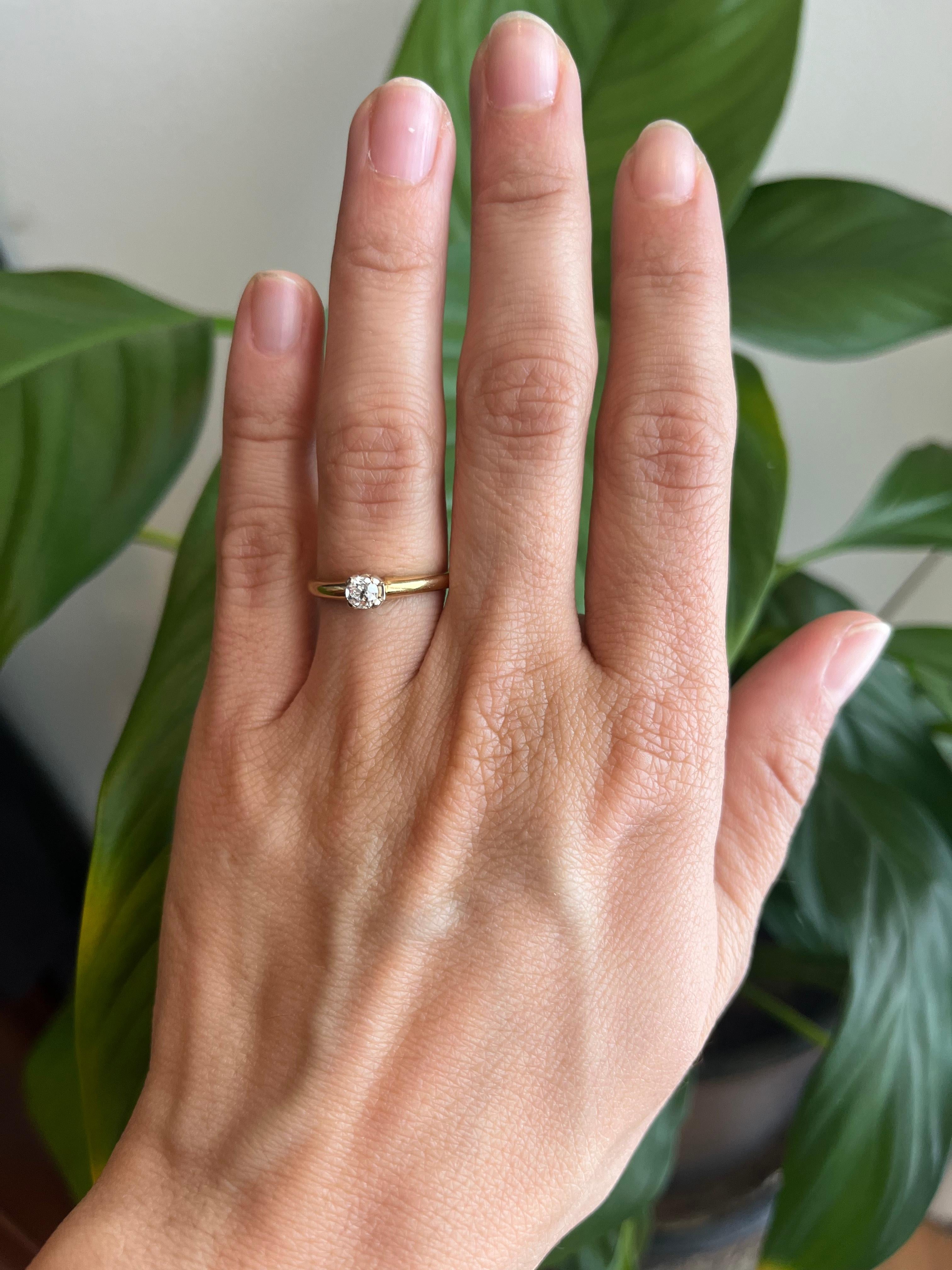 A genuine 0.16ct antique old mine cut diamond set in a 1950s 14K gold solitaire mounting. A petite heirloom with soul and sparkle. From our vintage estate fine jewelry collection.

- 0.16ct antique old mine cut natural diamond, VS1 clarity, H