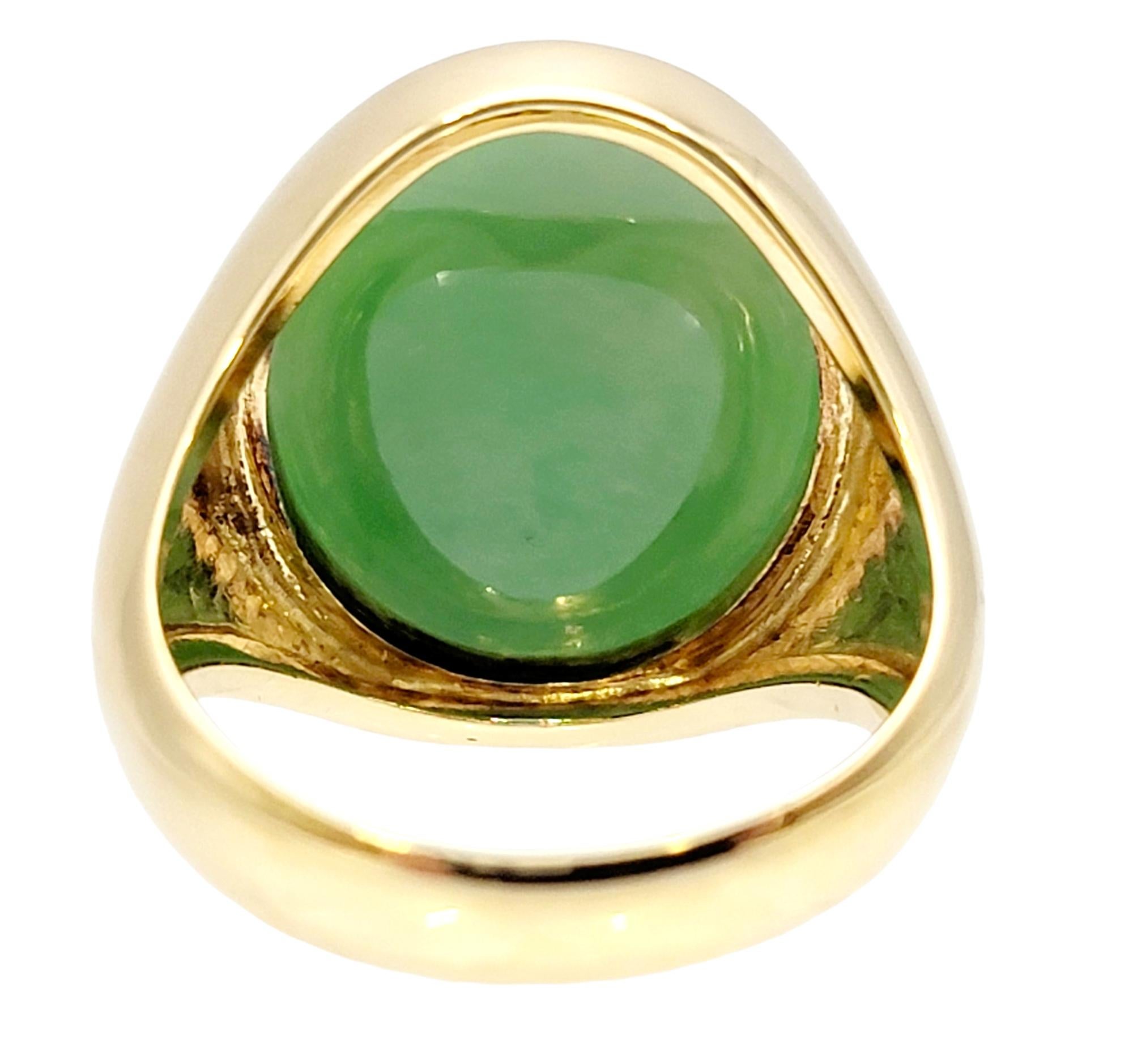 Contemporary Solitaire Oval Cabochon Light Green Jadeite Ring in 14 Karat Yellow Gold Unisex For Sale