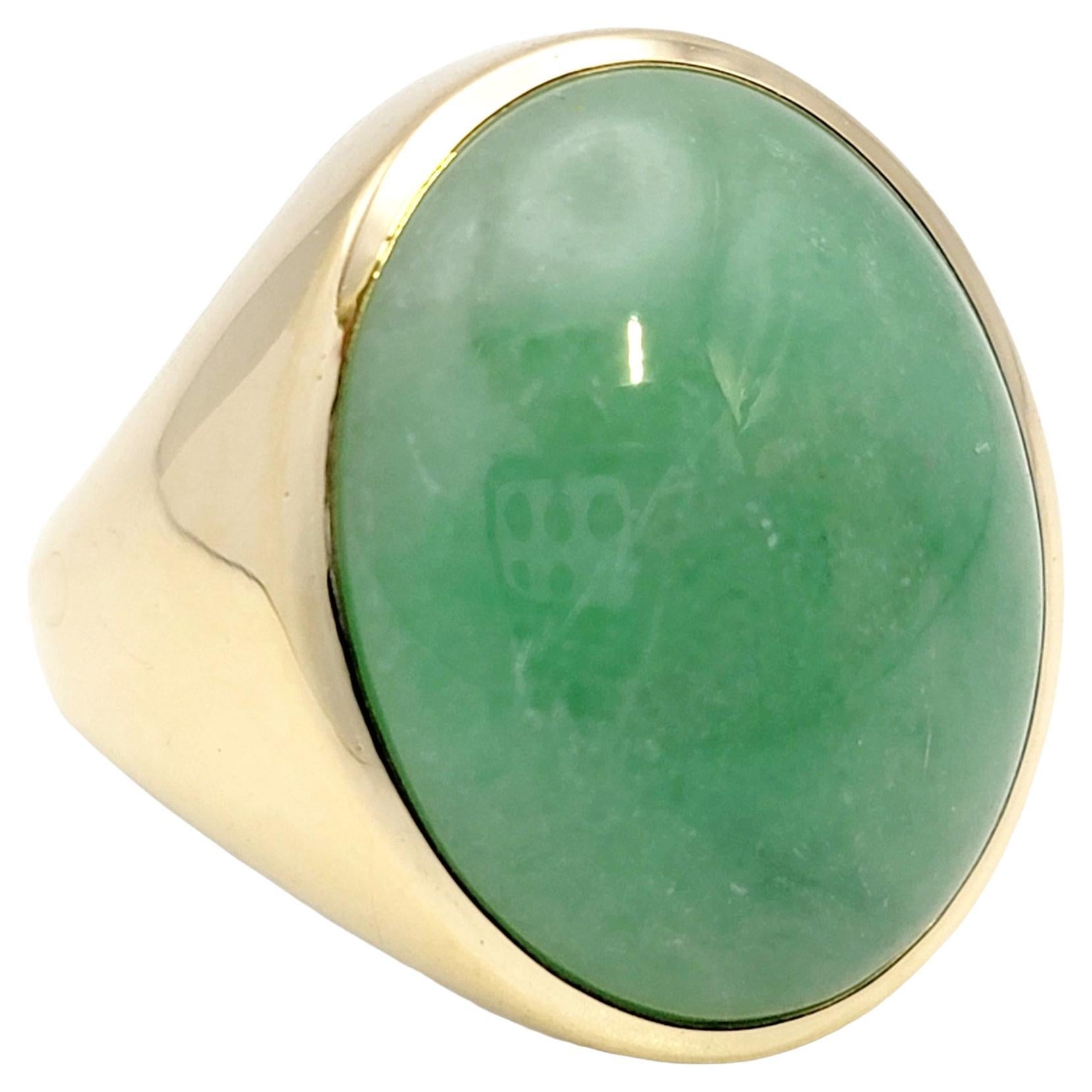 Solitaire Oval Cabochon Light Green Jadeite Ring in 14 Karat Yellow Gold Unisex For Sale
