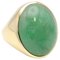 Vintage Solitaire Oval Cabochon Light Green Jadeite Ring in 14 Karat Yellow Gold Unisex