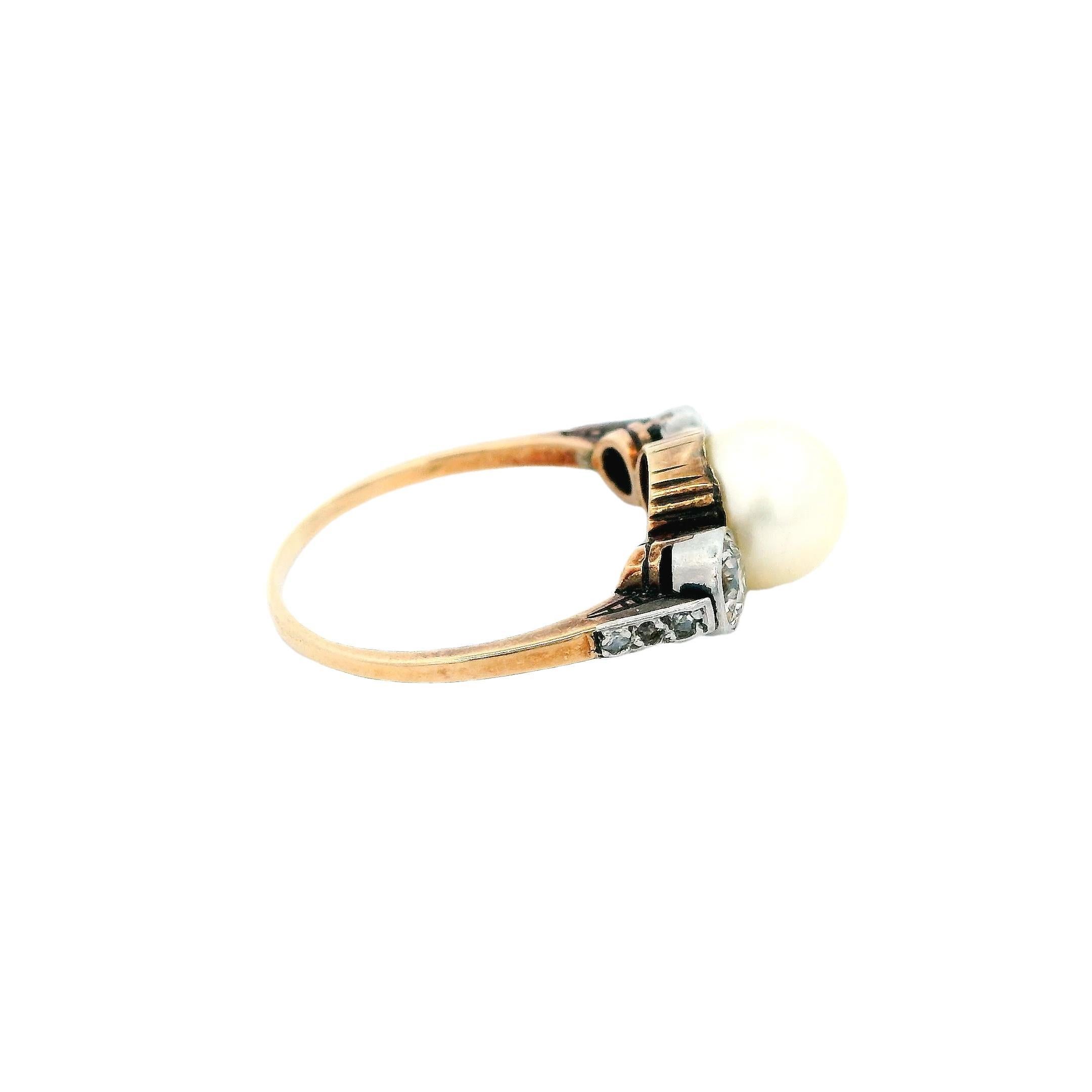 A harmonious blend of elegance and simplicity.

This captivating ring features a lustrous 2.0 carat natural pearl, its white hue exuding timeless beauty. Flanking the pearl are two old European cut diamonds, each weighing 0.5 carats. The diamonds,
