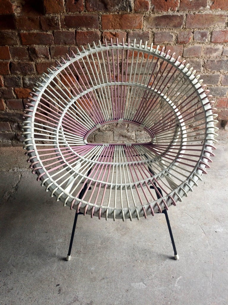 Extremely rare and quite possibly one of only a few of its kind in existence, the Solitaire rattan chair by Janine Abraham and Dirk Jan Rol, France, circa 1950s, the seat made of rattan is coated in a pink and white plastic sleeving making this a
