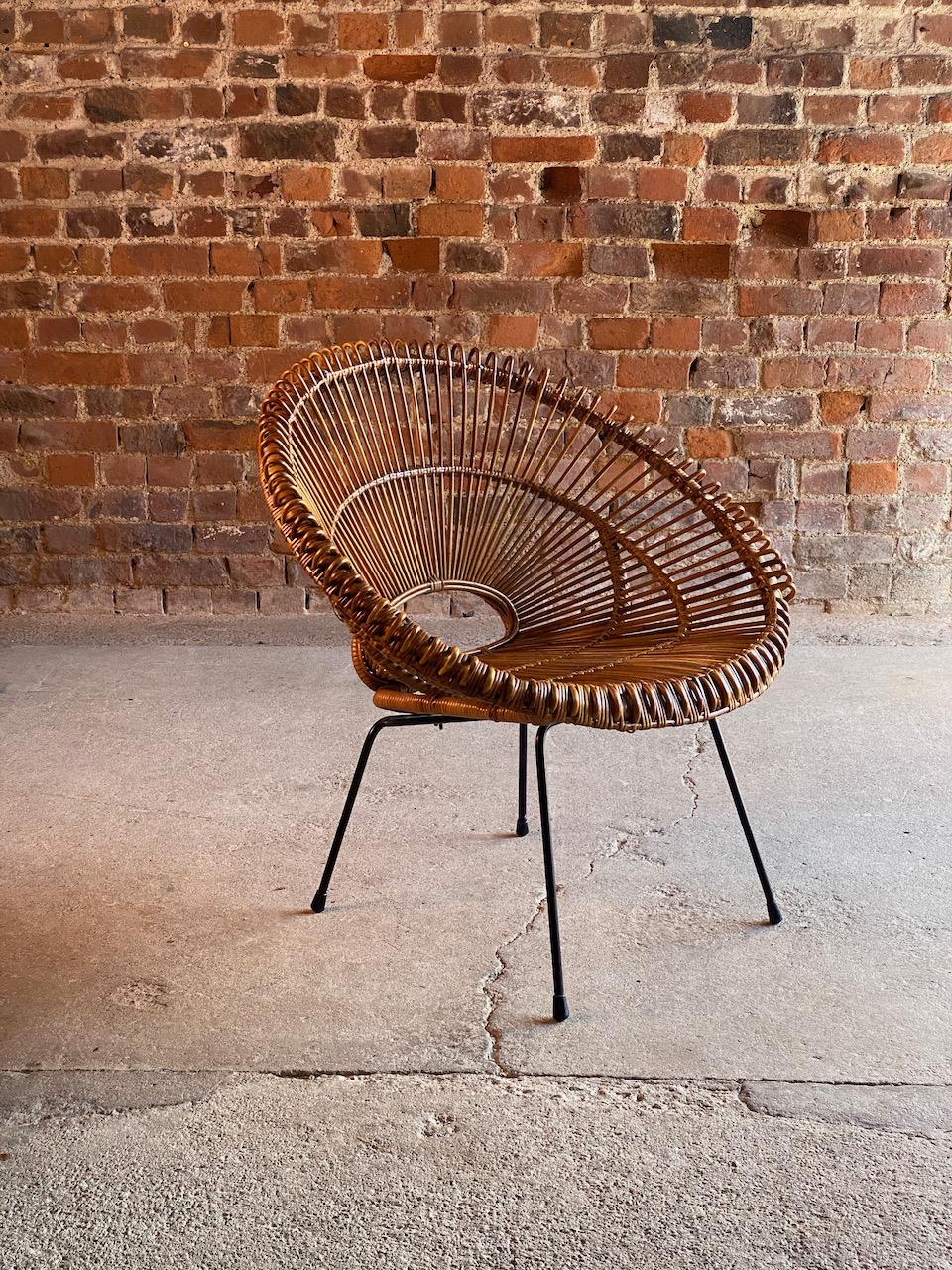 Solitaire Rattan chair by Janine Abraham & Dirk Jan Rol France circa 1950

Fabulous mid century French Solitaire Rattan Chair by Janine Abraham and Dirk Jan Rol France circa 1950s, the beautiful sunburst design with its deep bucket seat with
