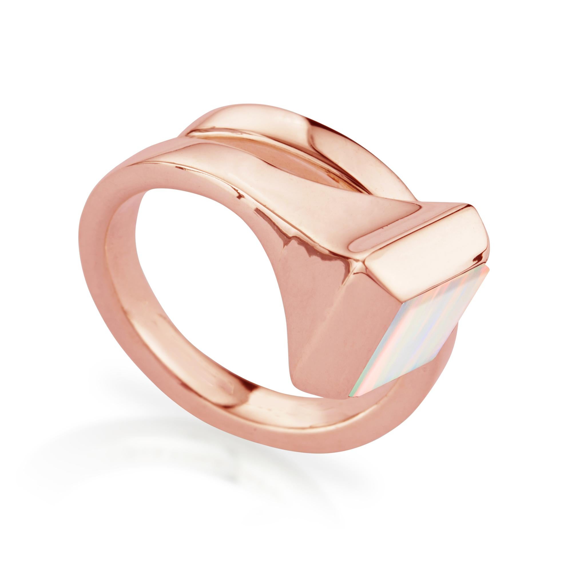 Modern ring in rose gold, set with opal, a gemstone which stimulates creativity and strengthens memory. Shaped to twist organically around the finger. Rebellious and sophisticated with a rock vibe. The design is inspired by the equestrian world,