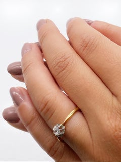 Solitaire Ring in Yellow Gold and 18 Karat White Gold with a Diamond