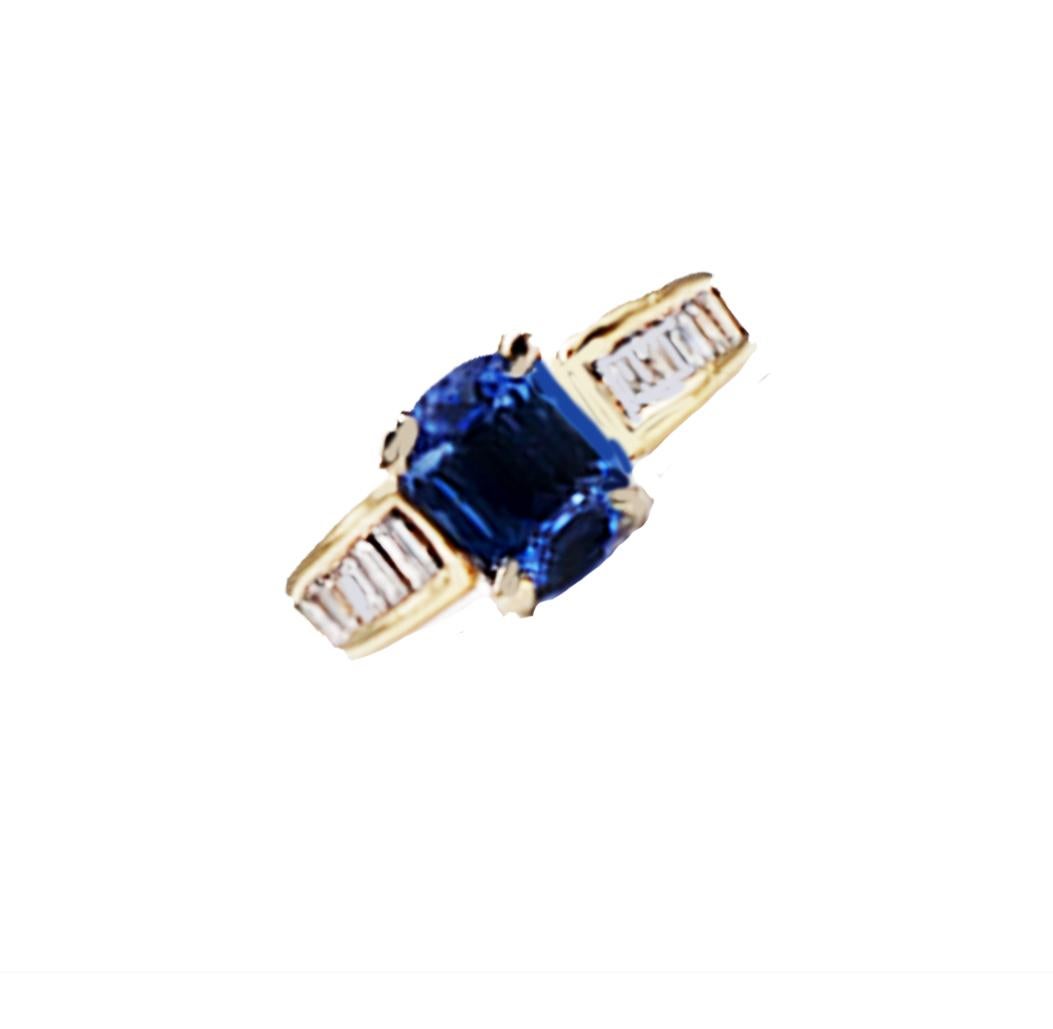 Emerald Cut Tanzanite and Baguette Diamonds set in rich colored, 14 karat Gold
A ring's overall complete weight is estimated as 1.40 carats.

Stunning tanzanite (7.15-5.36mm) measures .88 carat set in center to showcase the ring. Accenting