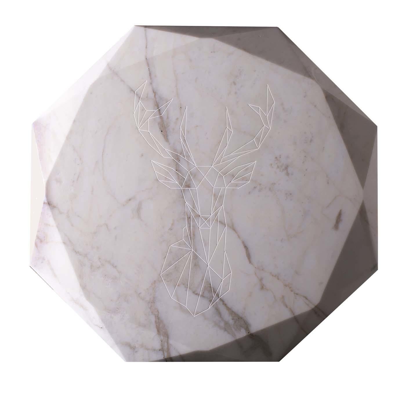 This remarkable tabletop shows marble in its most expressive character and an out-of-the-ordinary elegance. Featuring a sculptural form, the glossy white Calacatta marble is defined by a refined profile with a diamond cut shape and a striking