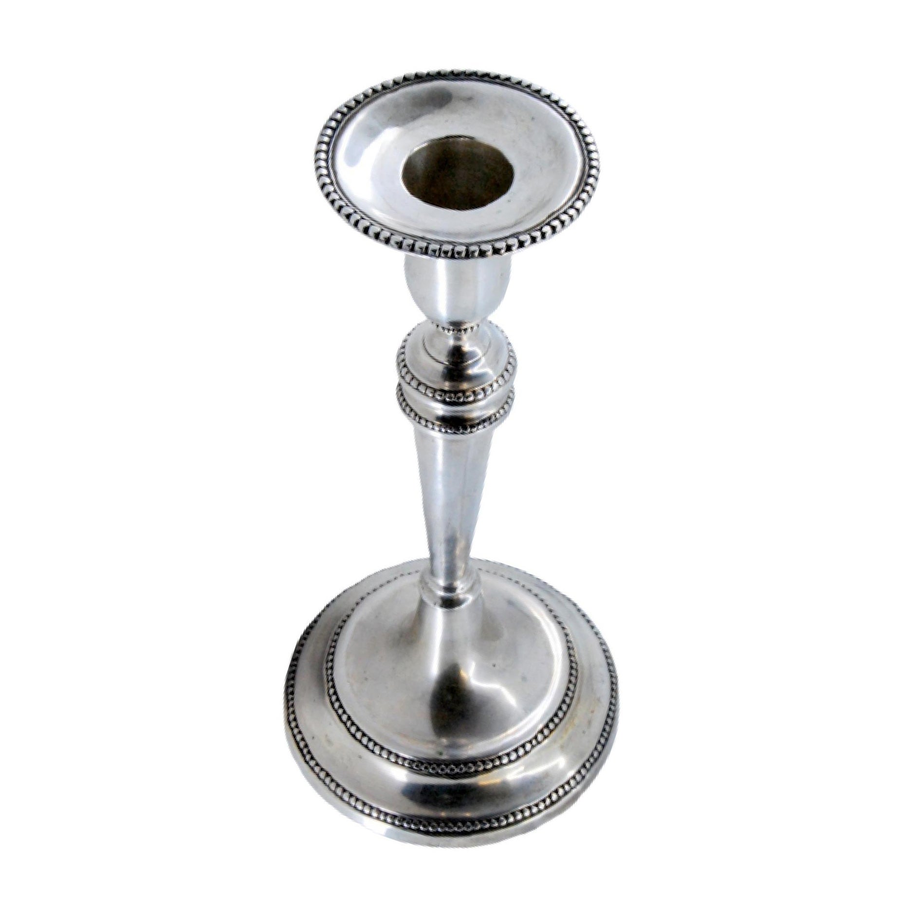 Solitary candlestick in smooth silver w/ friezes on the shaft
circular base