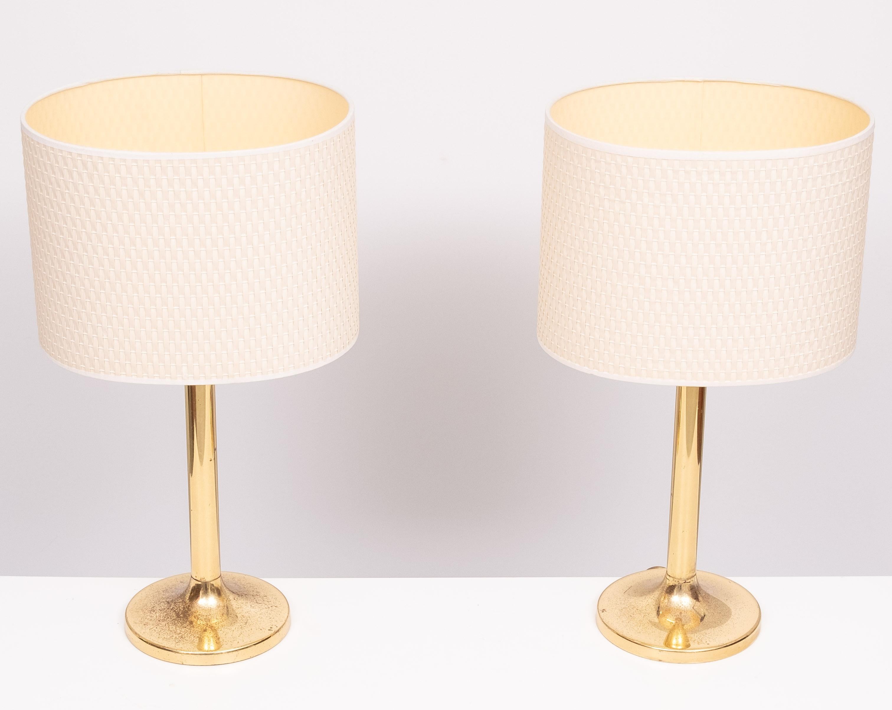 Very nice set of Brass table lamps .Manufactured by Sölken Leuchten 
1970s Germany . new rewired . beathiful patine .Large E27 bulb needed .
comes with off White braided shades . 