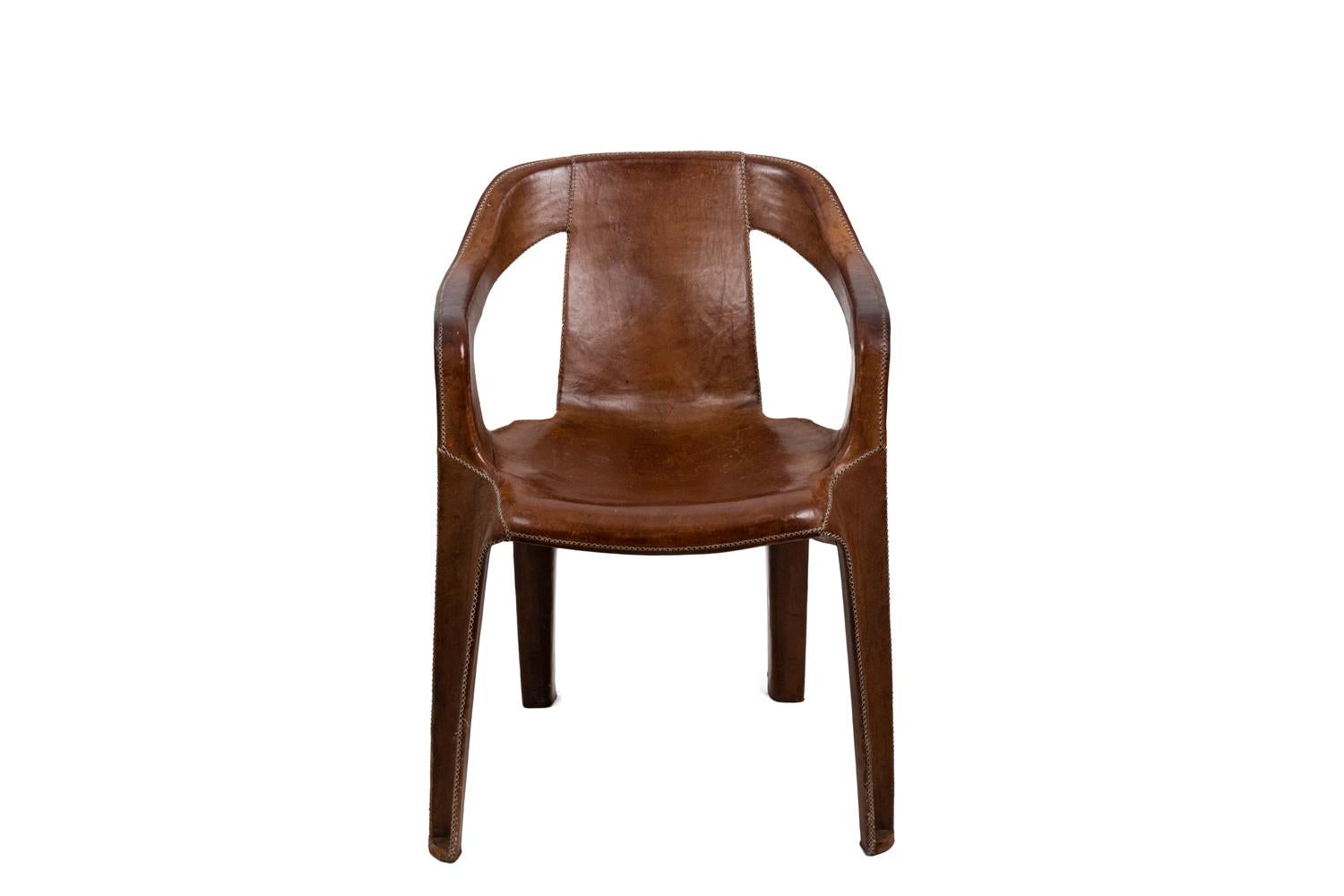 Sol&Luna, signed.
Armchair in brown leather with visible white sewings standing on a four legs forming angles. Seat slightly concave. Arms on the leg lines go up until the rectangular back.

Spanish contemporary work.

Leather slightly