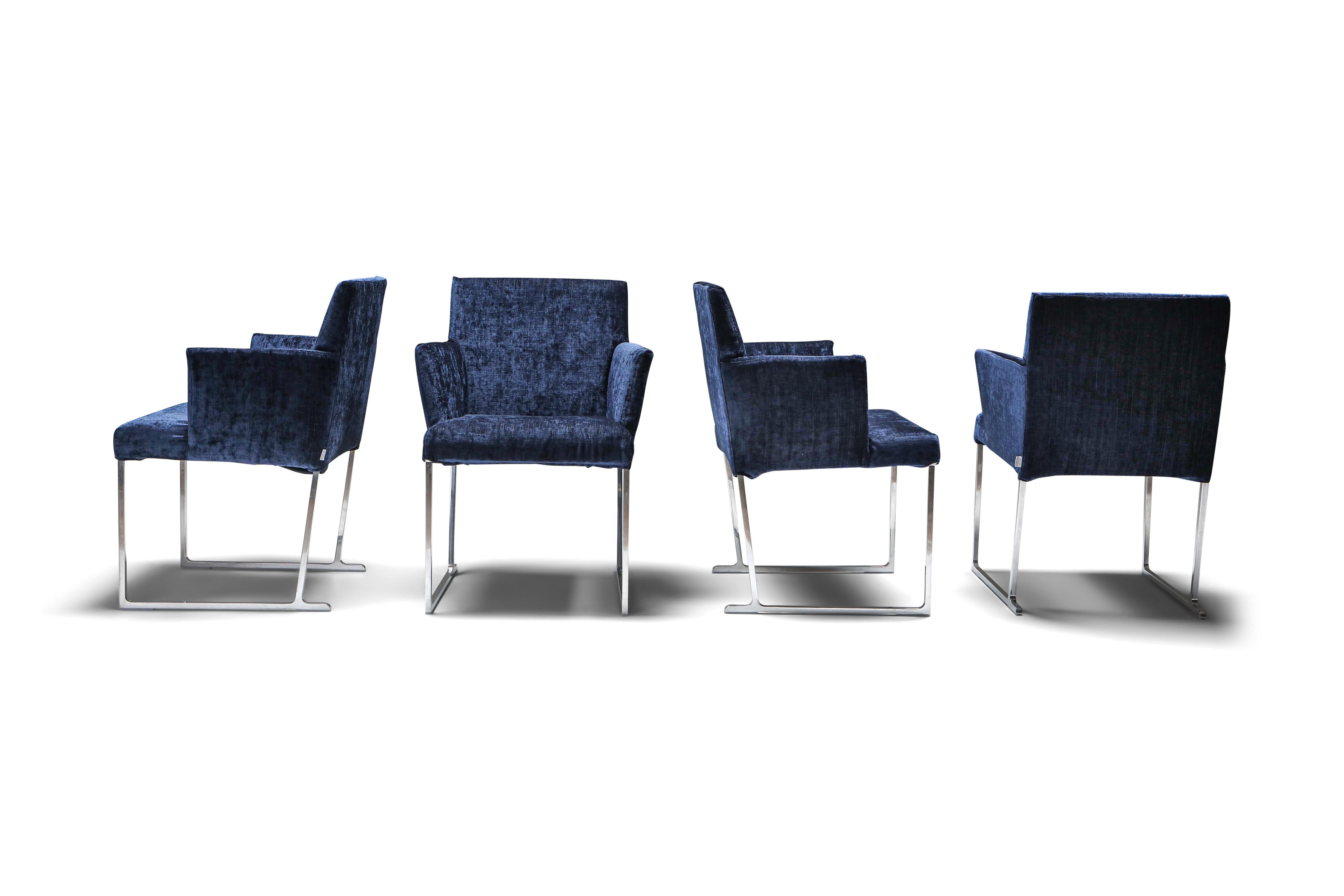 Solo armchairs by Antonio Citterio in luxurious dark blue velvet for B&B Italia. Made under the esteemed B&B Italia brand, these pristine armchairs redefine the concept of contemporary seating with their distinctive features. They are distinguished