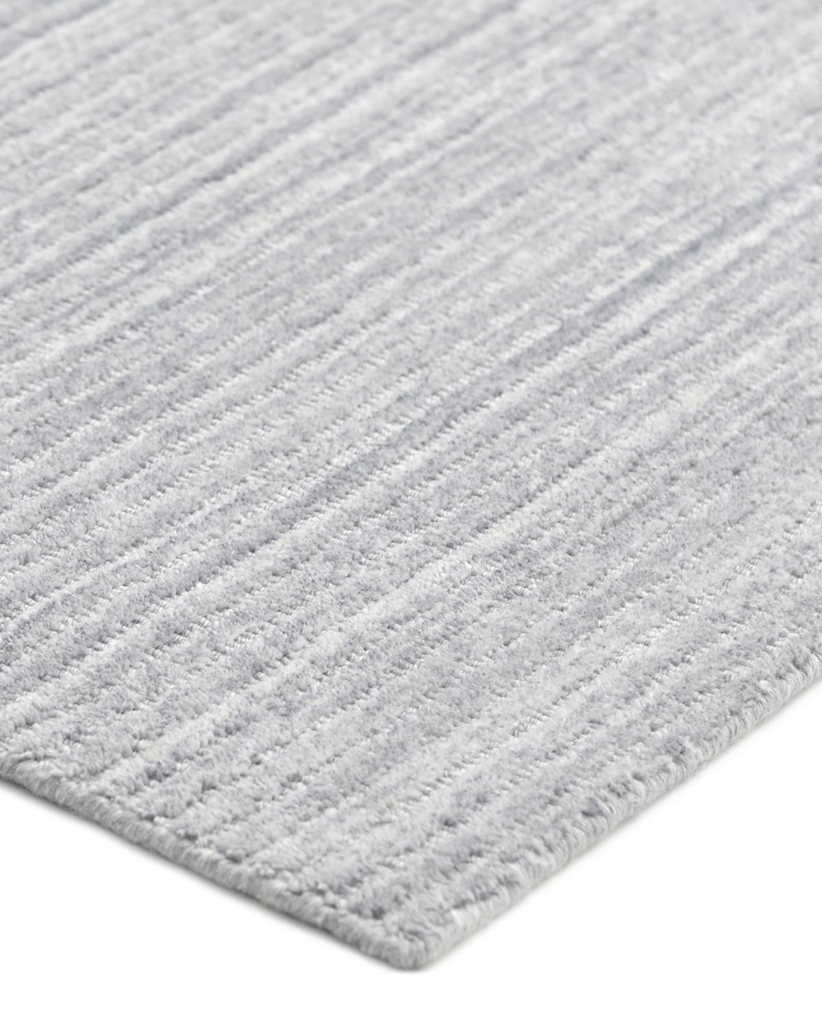 Subtle tone-on-tone stripes give the Solid collection a depth and sophistication all its own. These rugs can pull the disparate elements of a room into a beautifully cohesive whole; they can also introduce an unexpected but welcome jolt of color