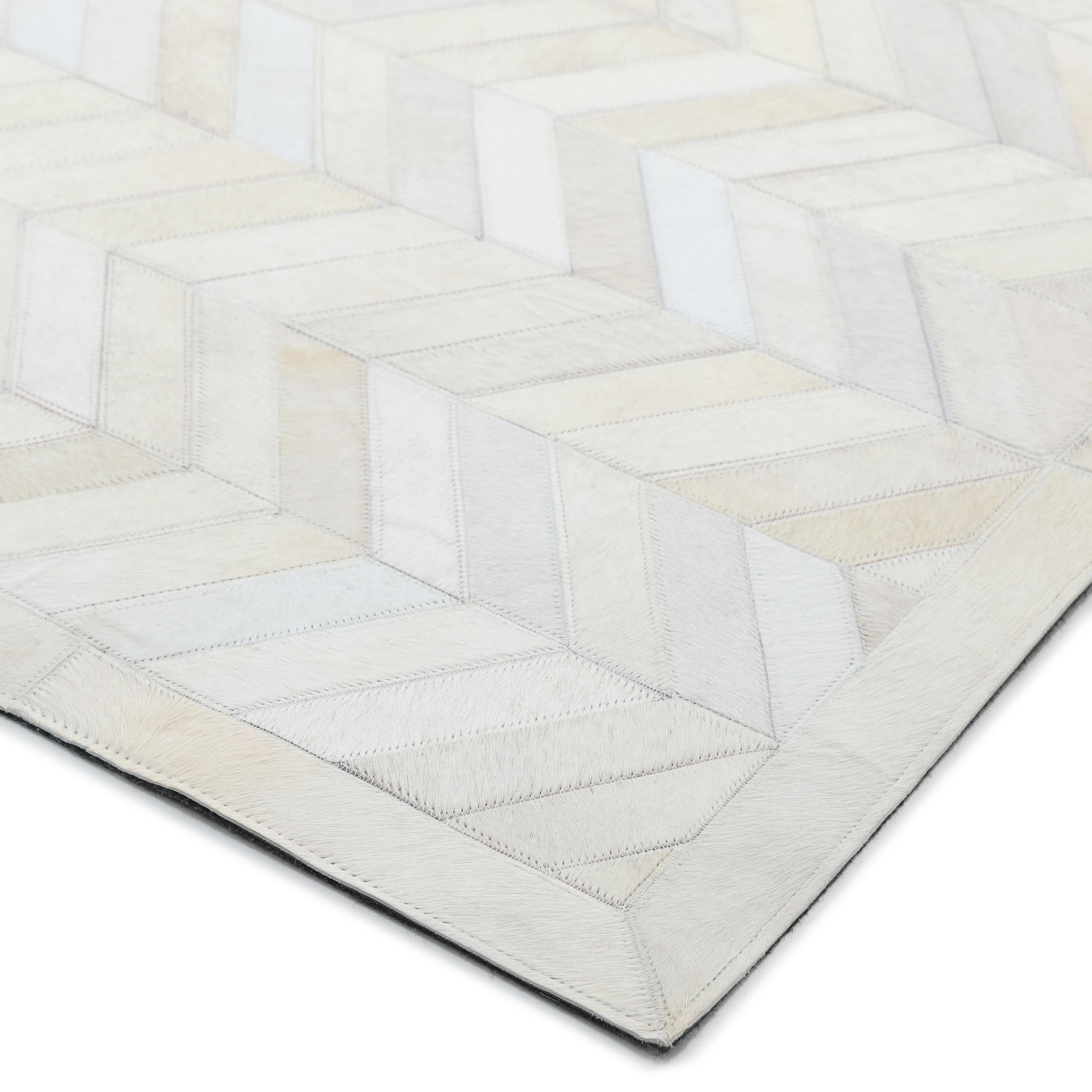 The Cowhide collection shows how urbane “rustic” 100%-natural hair-on hides can be. The natural variations of the hides add warmth and depth to the geometric motifs and give each rug a beauty of its own. The rugs include felt backing for extra