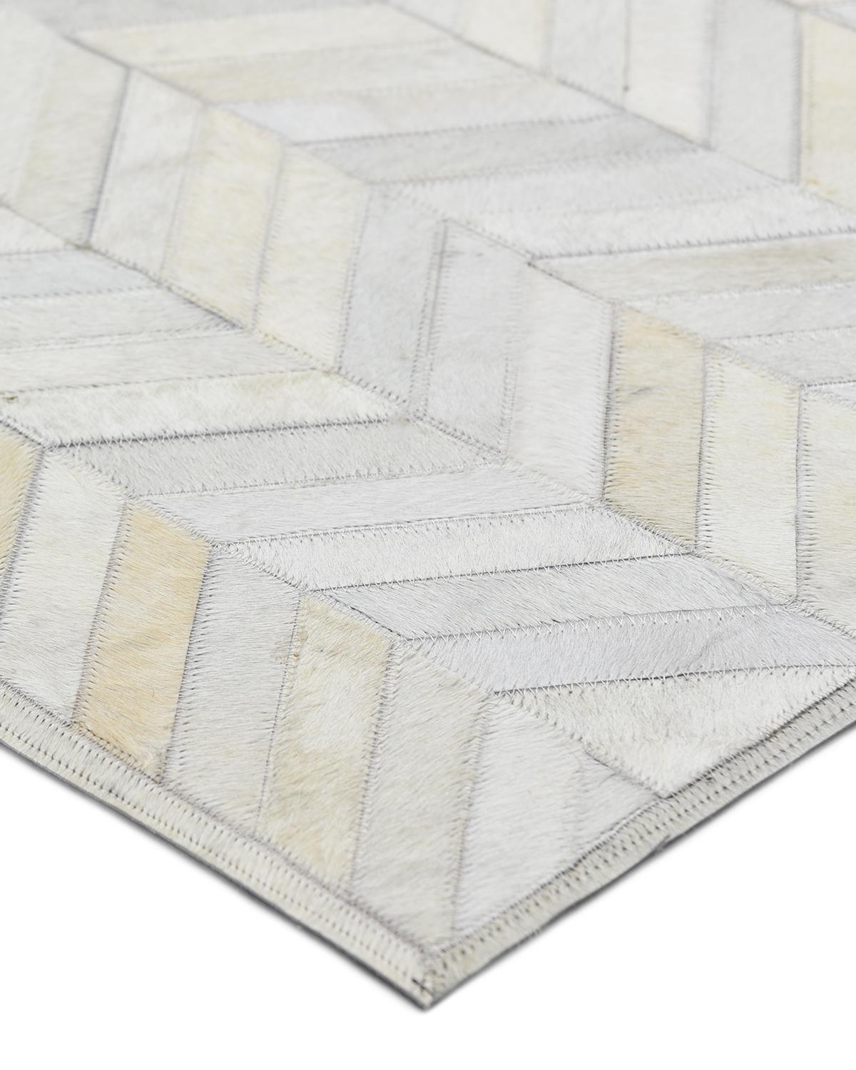 The Cowhide collection shows how urbane “rustic” 100%-natural hair-on hides can be. The natural variations of the hides add warmth and depth to the geometric motifs and give each rug a beauty of its own. The rugs include felt backing for extra