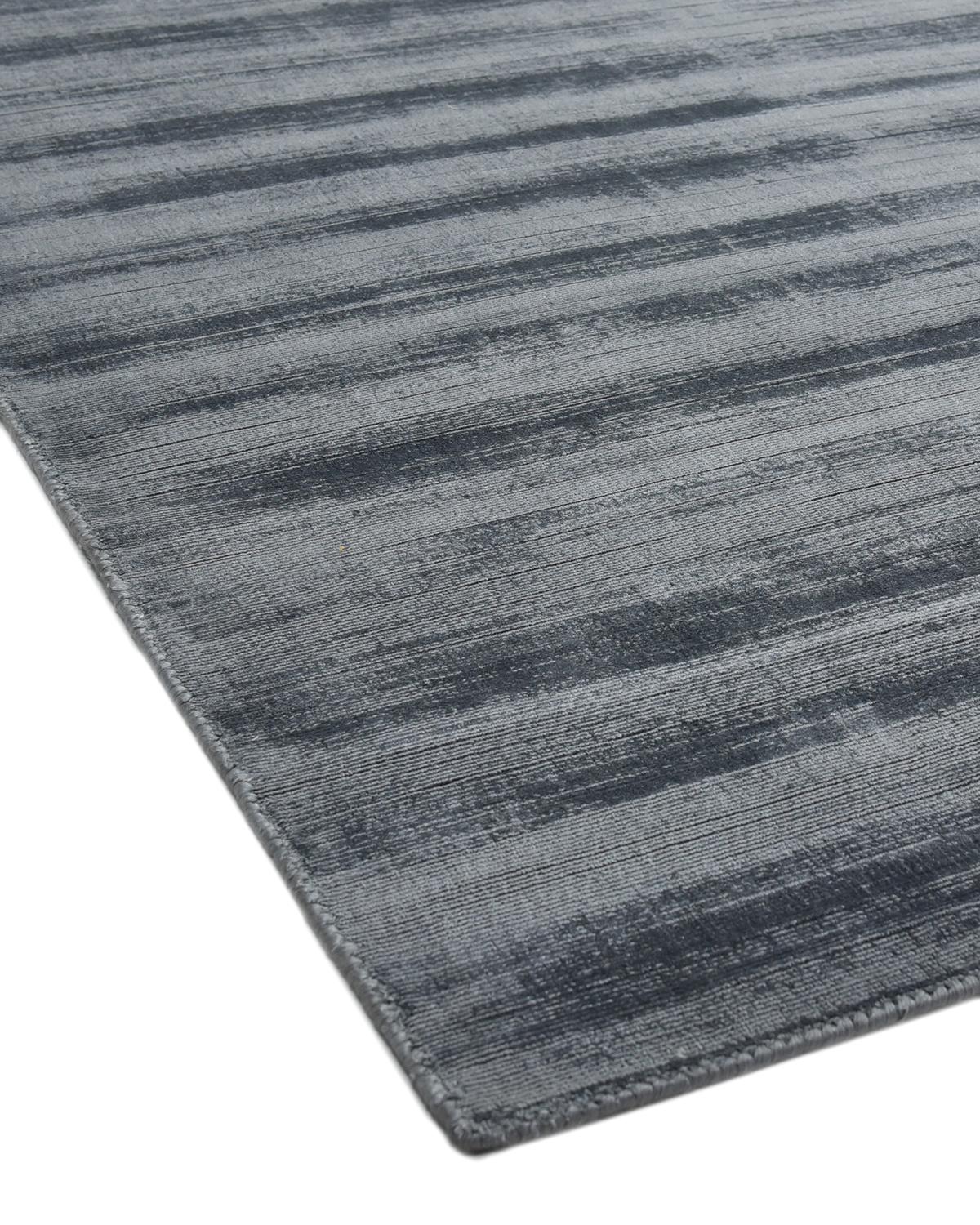 Subtle tone-on-tone stripes give the Solid collection a depth and sophistication all its own. These rugs can pull the disparate elements of a room into a beautifully cohesive whole; they can also introduce an unexpected but welcome jolt of color