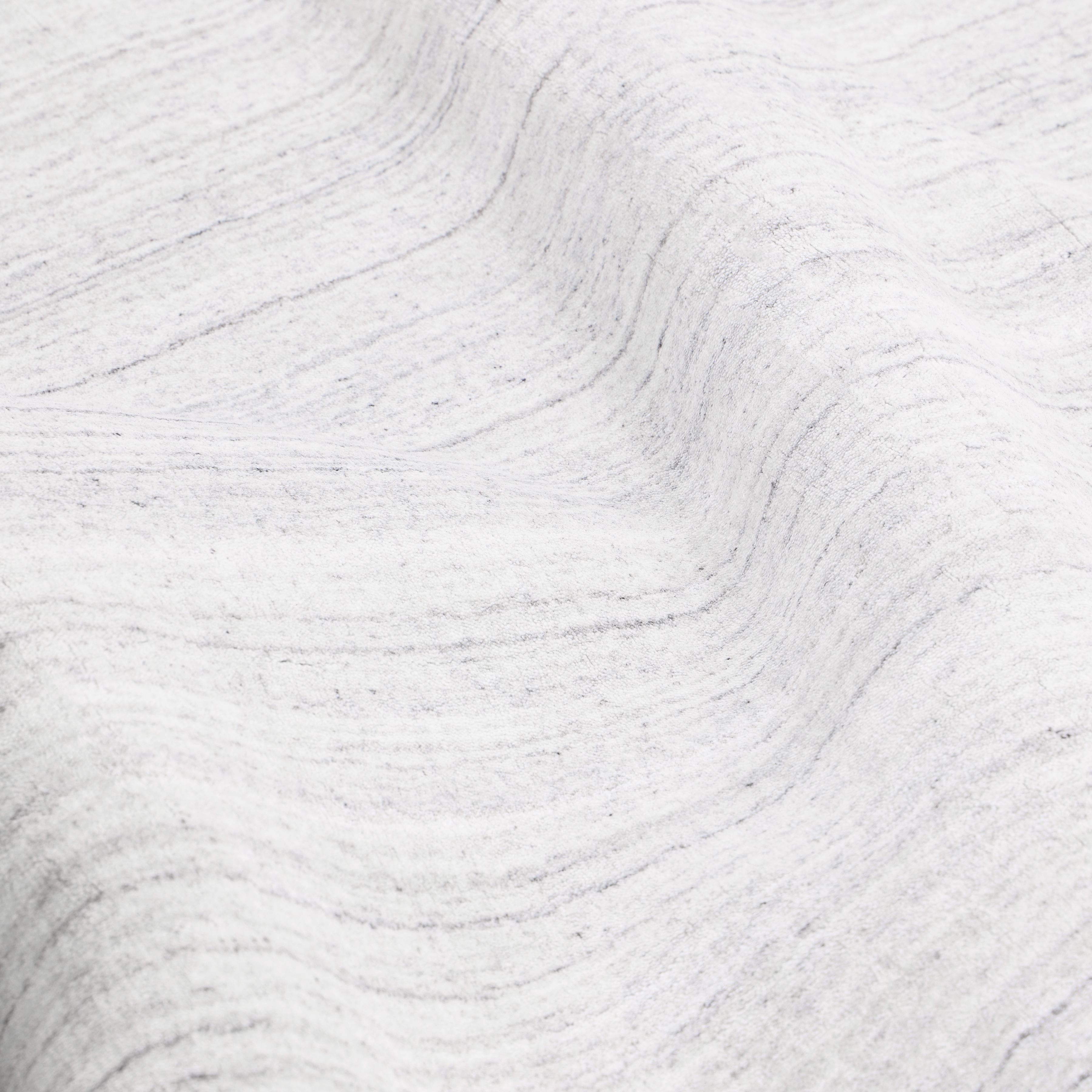 Subtle tone-on-tone stripes give the Solid collection a depth and sophistication all its own. These rugs can pull the disparate elements of a room into a beautifully cohesive whole; they can also introduce an unexpected but welcome jolt of color