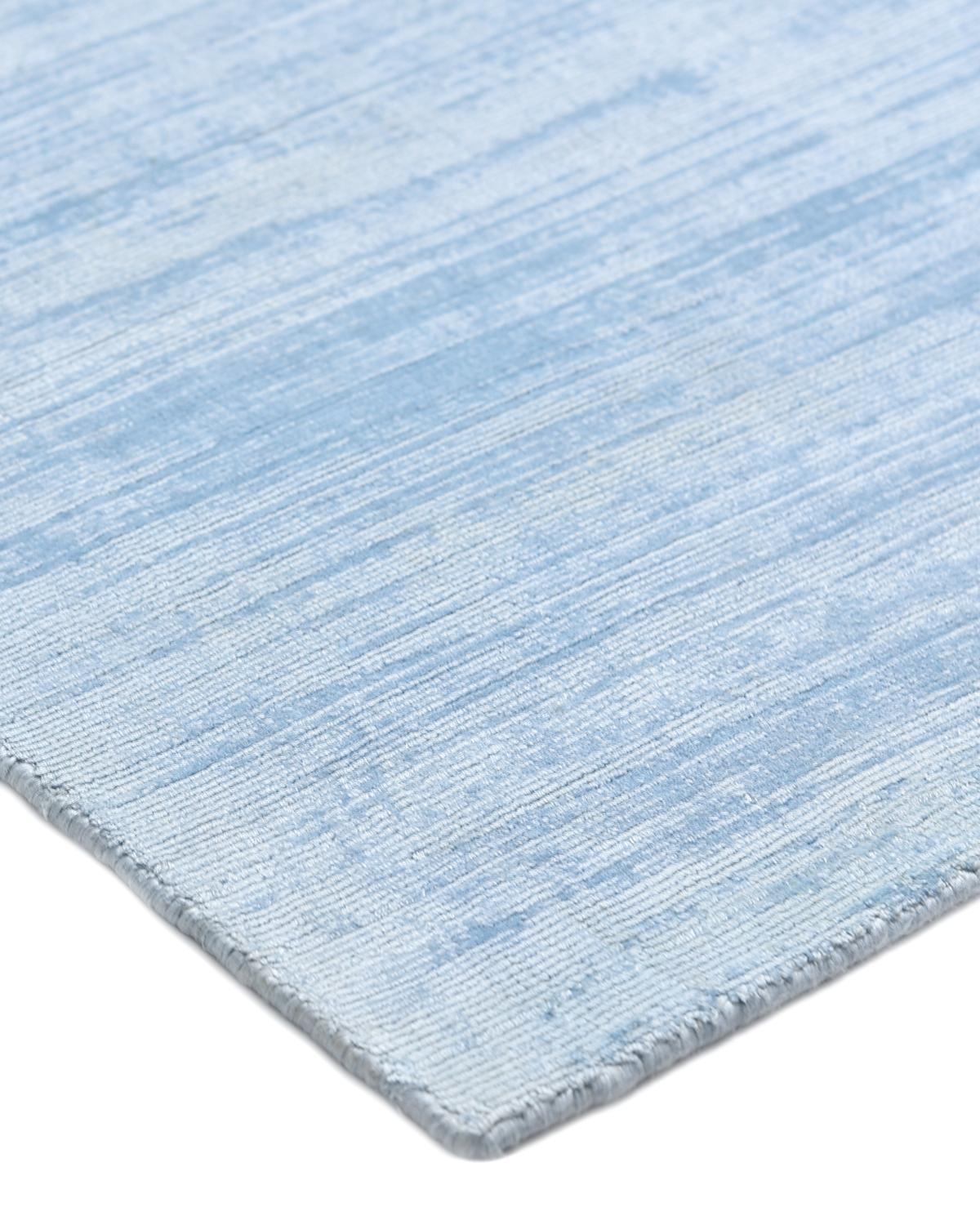 Subtle tone-on-tone stripes give the Solid collection a depth and sophistication all its own. These rugs can pull the disparate elements of a room into a beautifully cohesive whole; they can also introduce an unexpected but welcome jolt of color