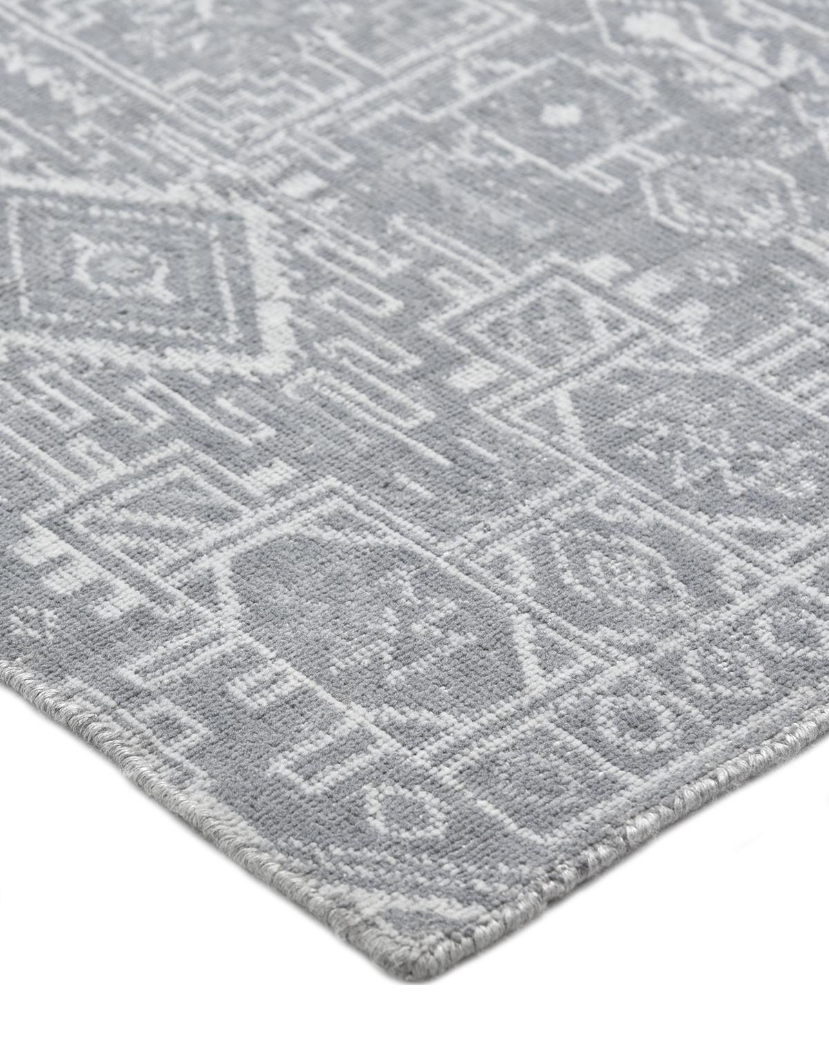 The rich textile tradition of western Africa inspired the Tribal collection of Hand-Knotted rugs. Incorporating a medley of geometric motifs, in palettes ranging from earthy to vivacious, these rugs bring a sense of energy as well as plush texture