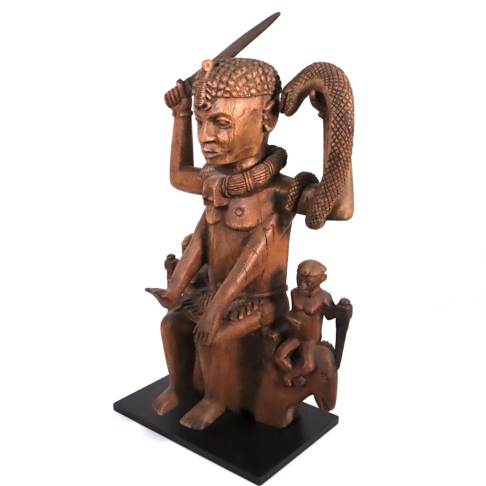 Tribal Wood sculpture of a tribal West African Deity Mami Wata derived from Hinduism For Sale